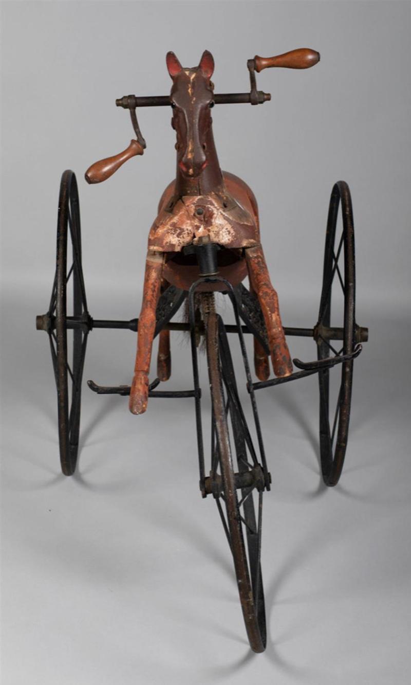 19th century wood and metal hobby horse tricycle
Measures: 31.5