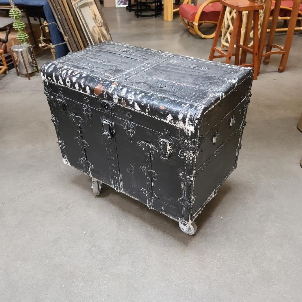 19th Century Wood and Metal Steamer Trunk with Leather Edges, the trunk has been repainted and repaired.