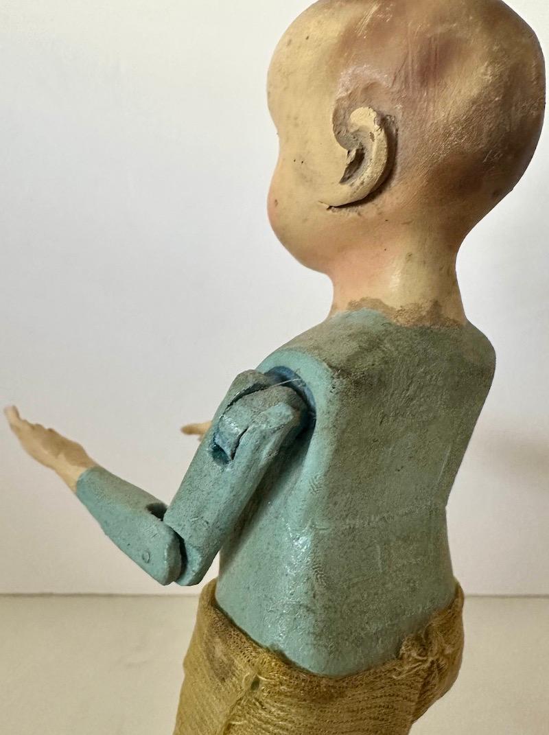 19th Century wood Santos of a boy/child with glass eyes and articulated arms. For Sale 4