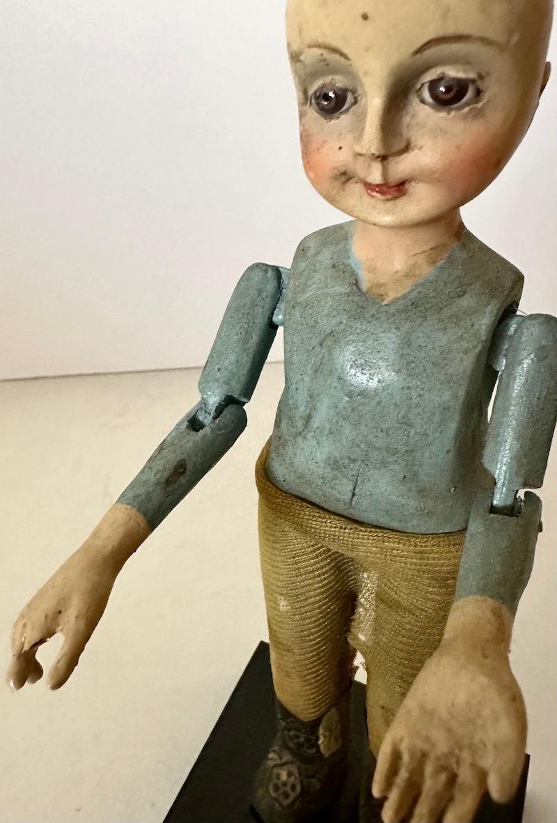 19th Century wood Santos of a boy/child with glass eyes and articulated arms. For Sale 5