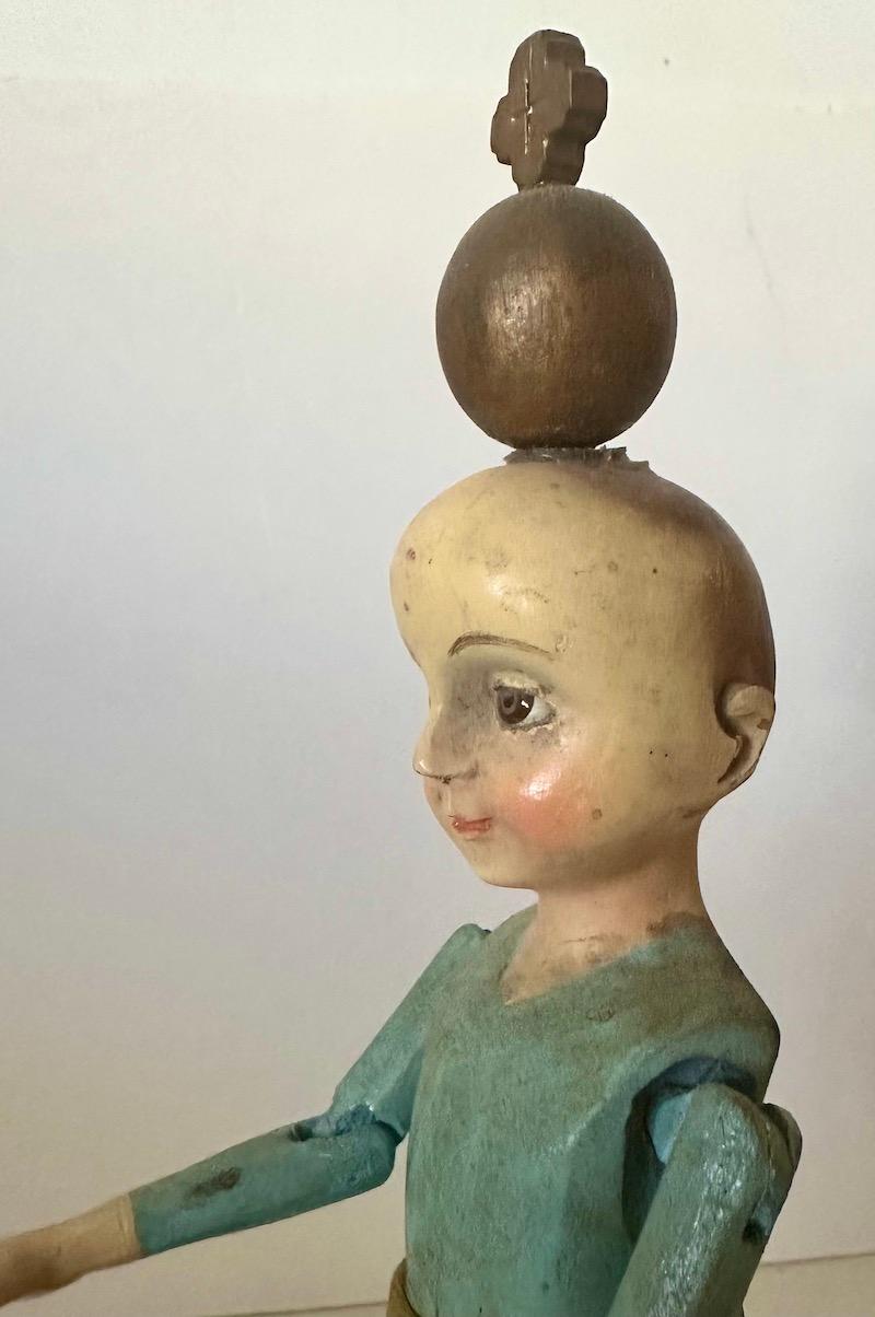 Spanish Colonial 19th Century wood Santos of a boy/child with glass eyes and articulated arms. For Sale