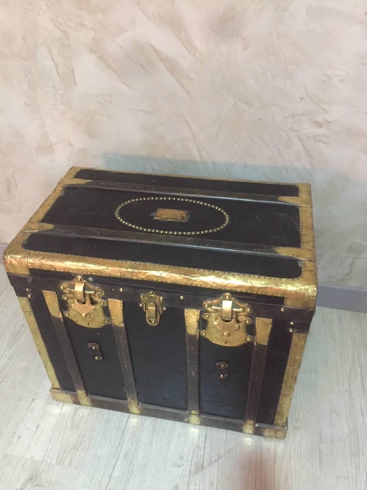 19th century wooden and gilded brass travel trunk. Coming from a French Manufacture (Lyon) as you can see on the brass plate. Leather handles.