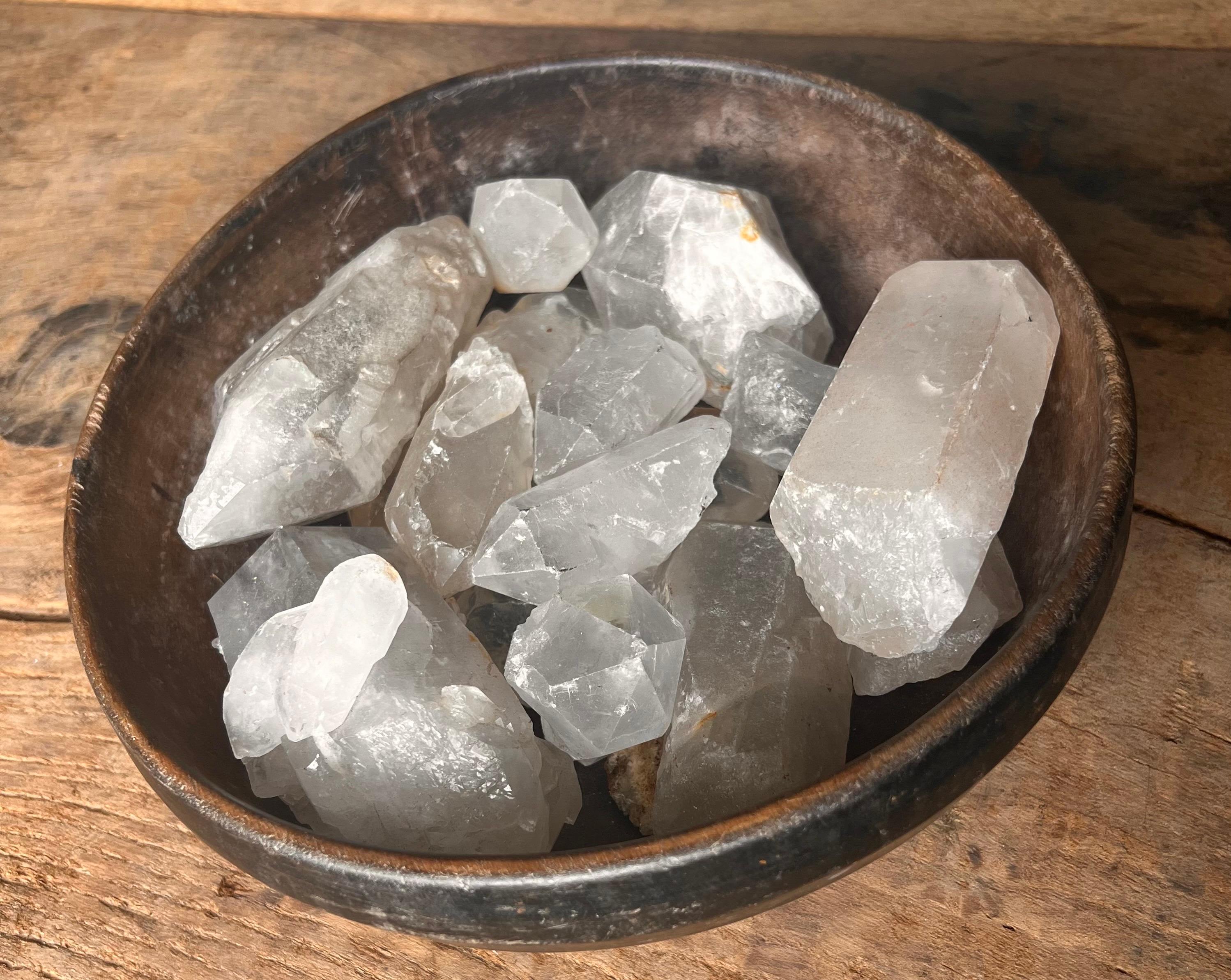 Beautifully patinaed hand-carved wooden bowl, made in the Netherlands.  
Natural crystals in varying shapes and sizes elevate this simple piece. 