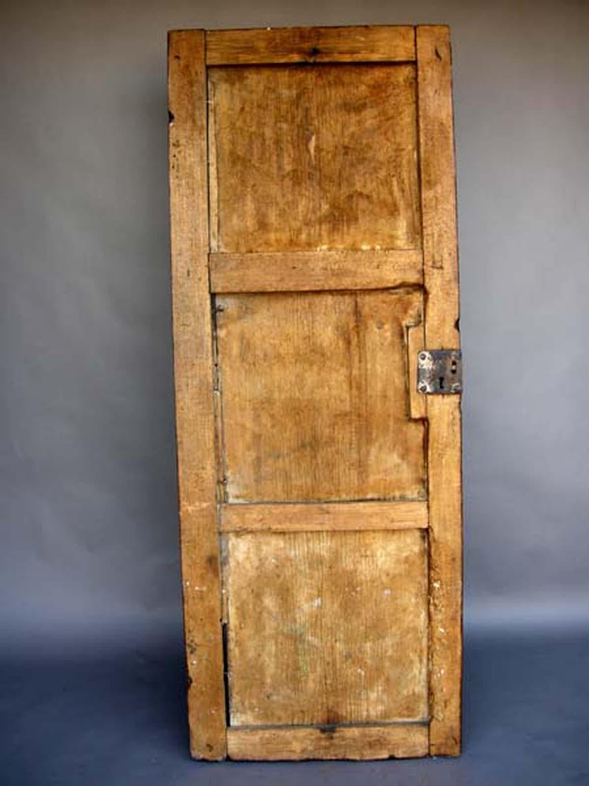 19th century single wooden door with original hardware. Beautiful, naturally worn patina throughout.