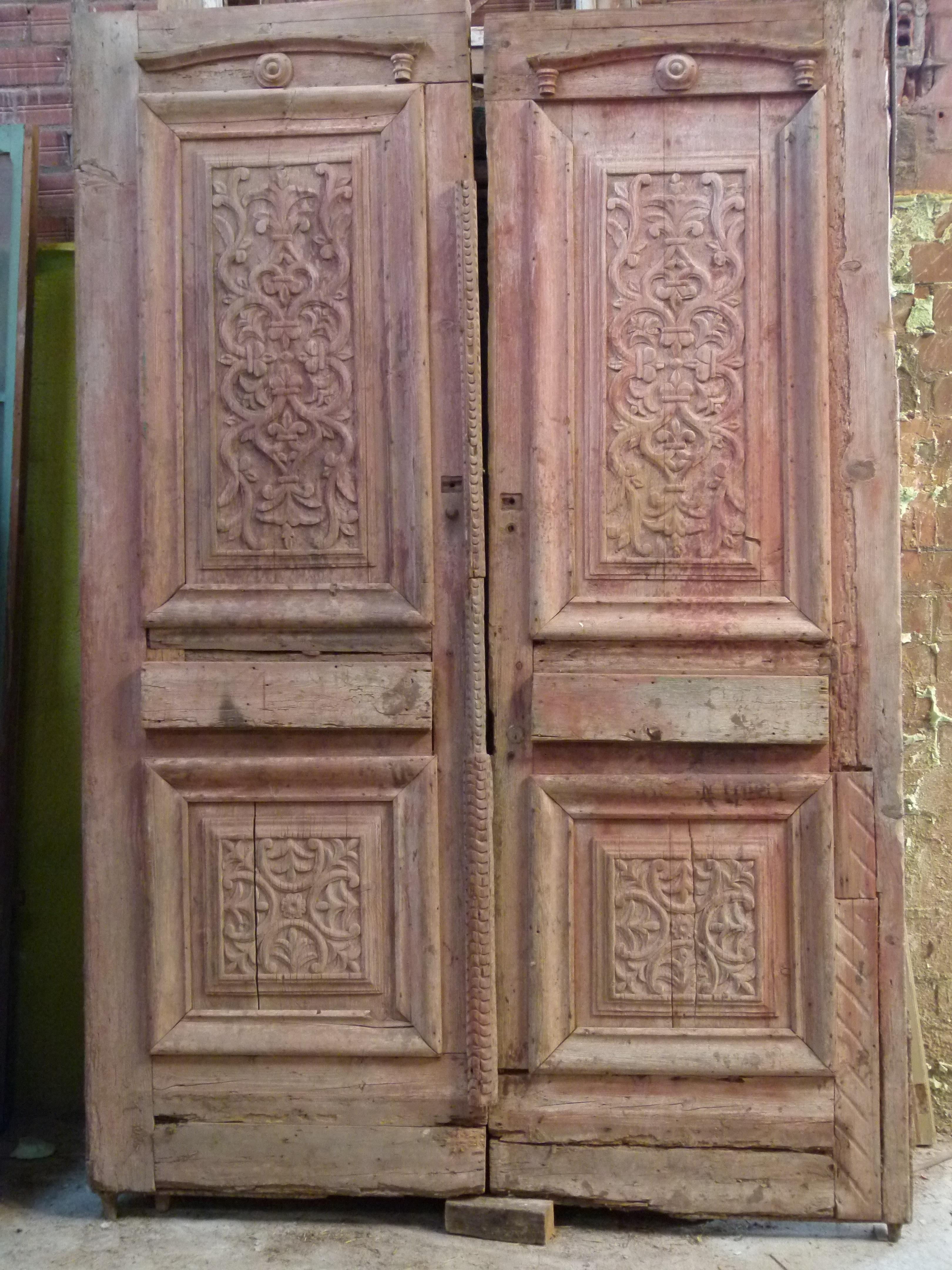 19th century wooden double door portal in Art Nouveau style from Catalonien, Spain.
Carved wood typical from this period.
Each door has 2 lateral pivots to be embedded in the stone.
The original patina of this portal and its style will give the