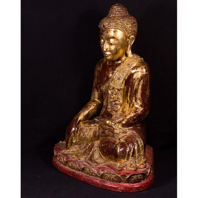 Material: wood
77 cm high 
63 cm wide and 41 cm deep
Weight: 30.25 kgs
Gilded with 24 krt. gold
Mandalay style
Bhumisparsha mudra
Originating from Burma
19th century
With inlayed eyes.

 
