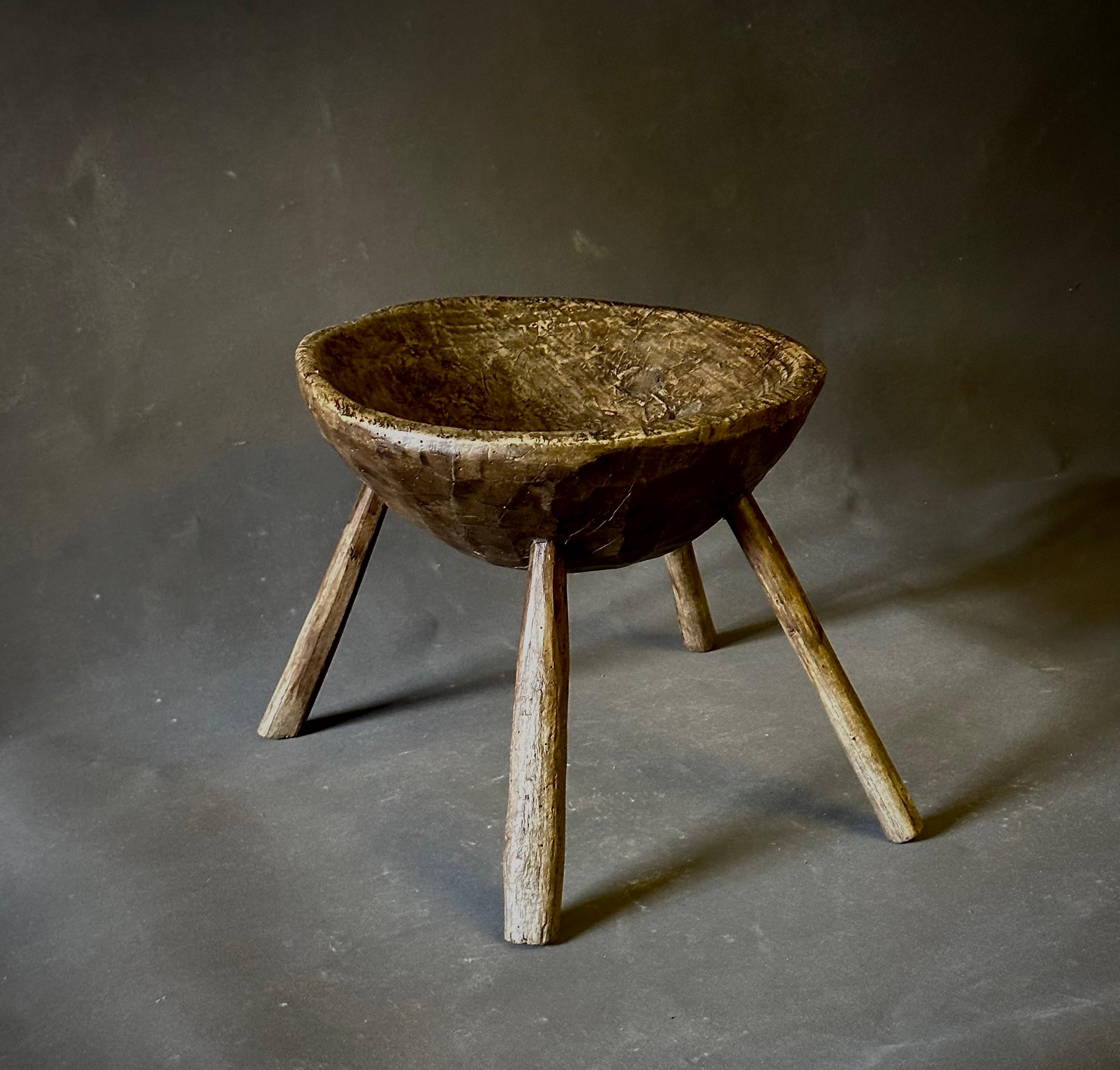 Belgian 19th century primitive wooden milking stool. Rustic and elemental of form, its cupped seat, four-legged base, and low-to-the-ground orientation make this a unique seating addition or sculptural accent piece. 

Belgium, circa