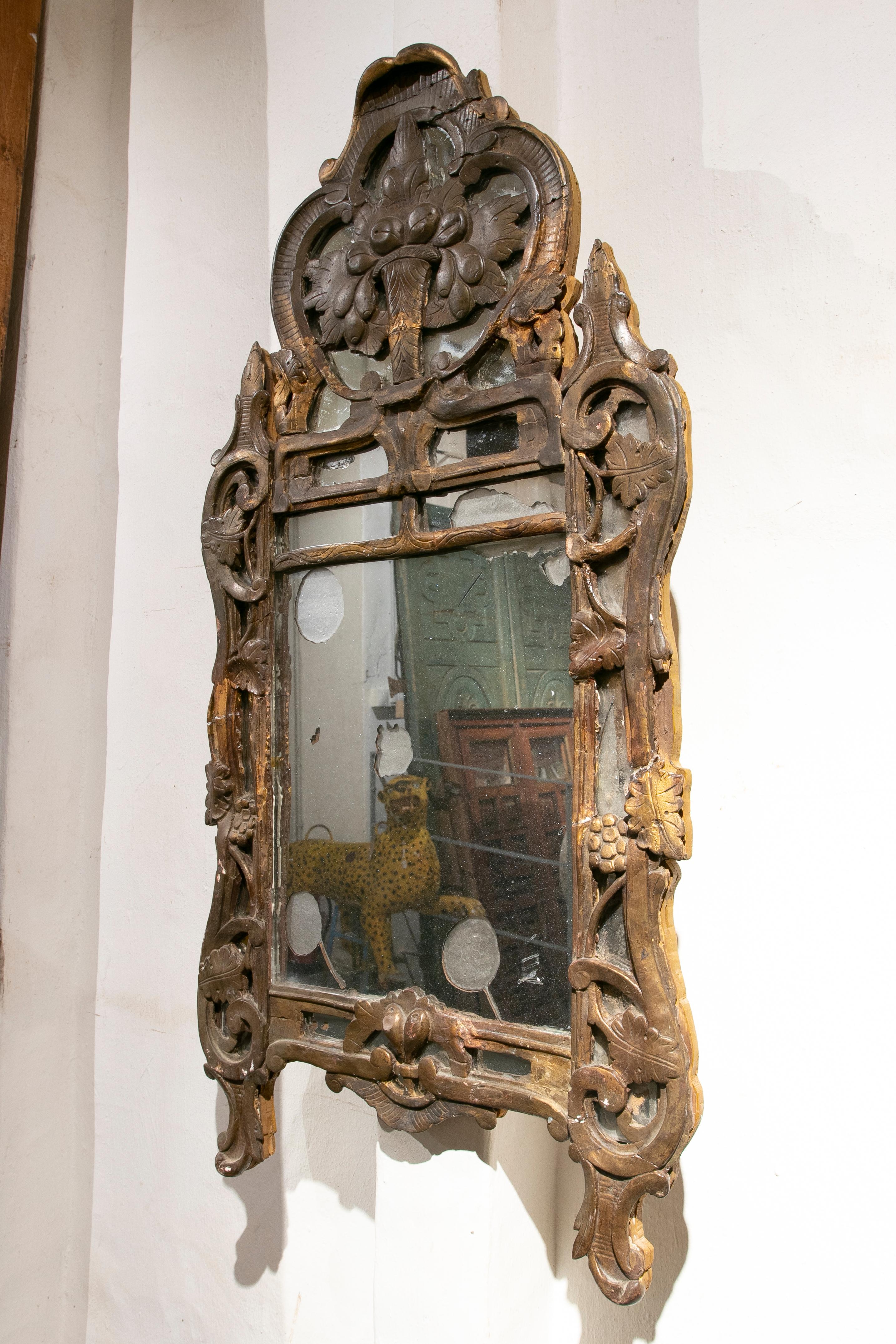 Spanish 19th Century Wooden Wall Mirror Hand-Carved with Traces of Gold For Sale