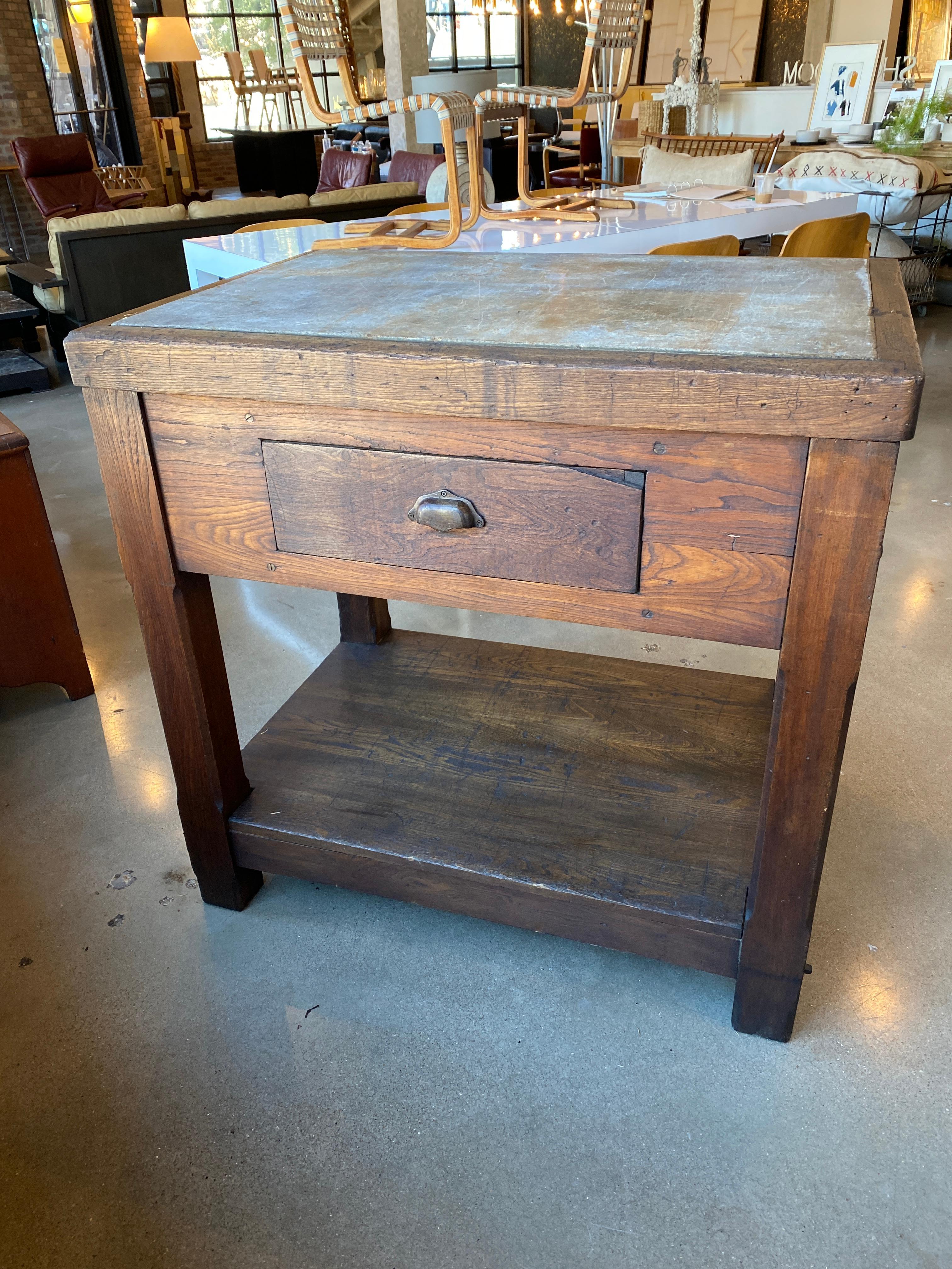 Substantially crafted work table, butcher block or island of solid oak with inset soapstone top and with one-drawer that slides between both sides. Could make beautiful center table or dry bar, Belgium, 19th century.
