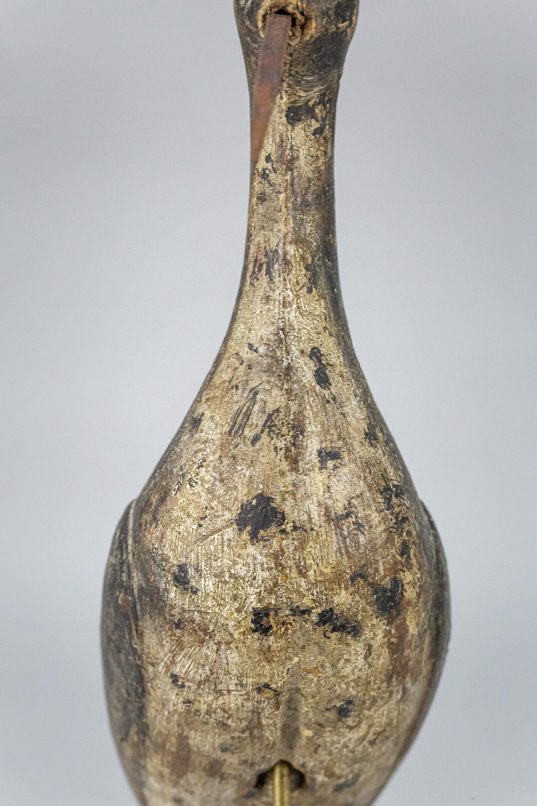 Wonderfully sculptural working shorebird decoy, found in original paint. Most likely a replacement beak. Later bespoke made stand, France, circa 1880.