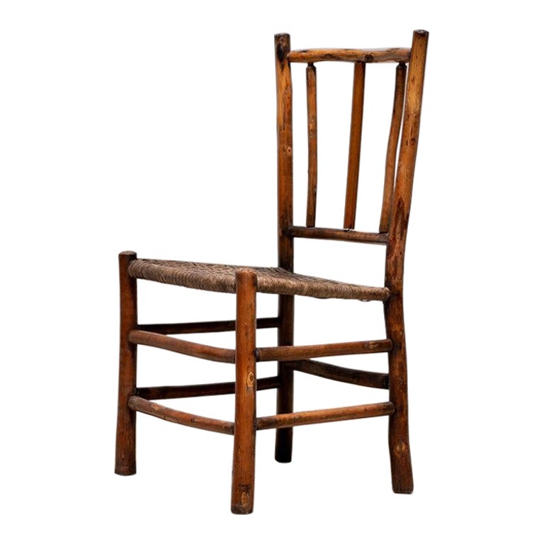 Silla antigua con asiento de tablilla tejida del siglo XIX procedente de Inglaterra en venta
