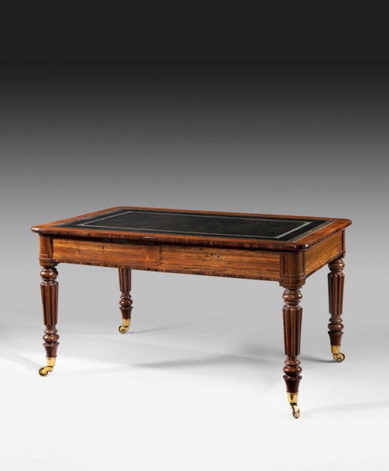 This partners’ table has a shaped rectangular leather inset top above four disguised frieze drawers. It is raised on turned, tapering and reeded legs with brass castors. 

The cabinet-making firm of Gillows was founded in 1728 by Robert Gillow
