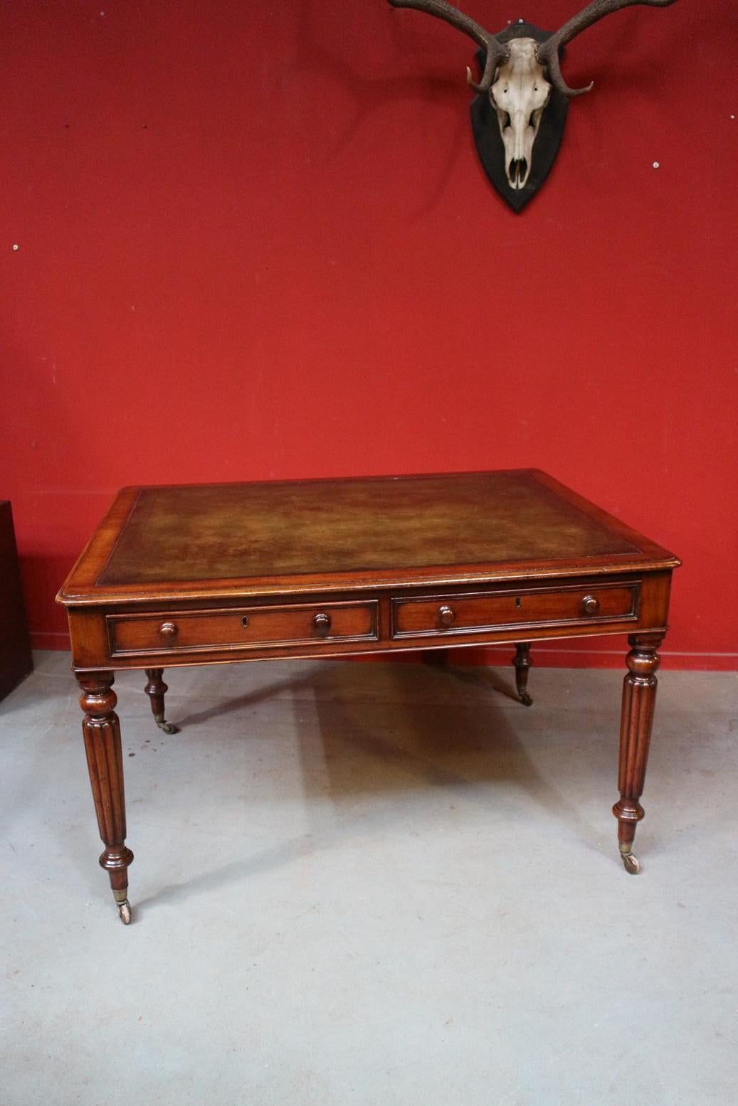 Beautiful antique mahogany writing table with 2 drawers. The table has a beautiful green leather top. Table is on wheels. Warm mahogany color. Entirely in very good condition.
Origin: England
Period: approx. 1840.