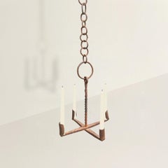 Araña de hierro forjado del siglo XIX