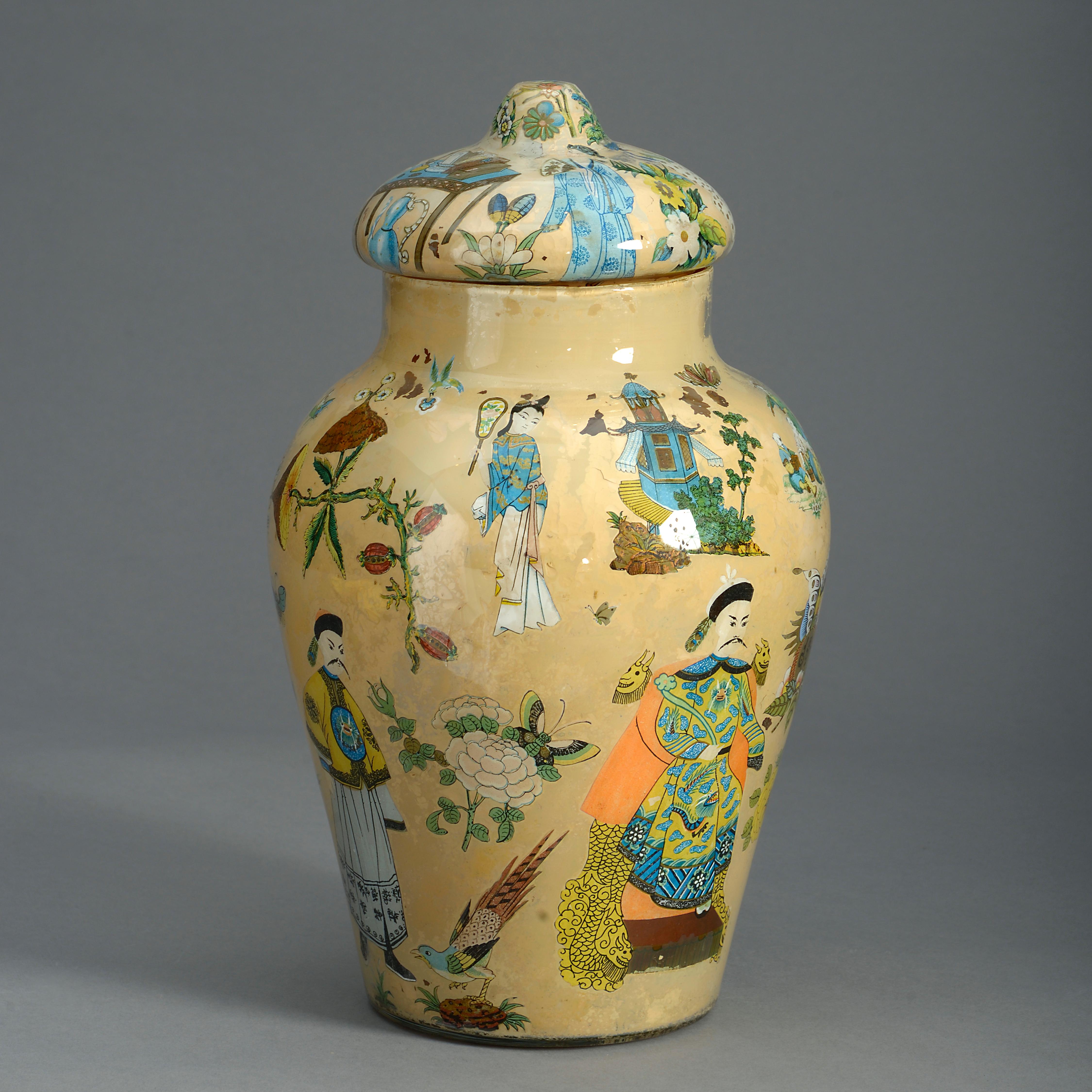 A charming mid-nineteenth century Decalcomania vase and cover, the body decorated throughout with polychrome chinoiseries upon a tobacco yellow ground.
