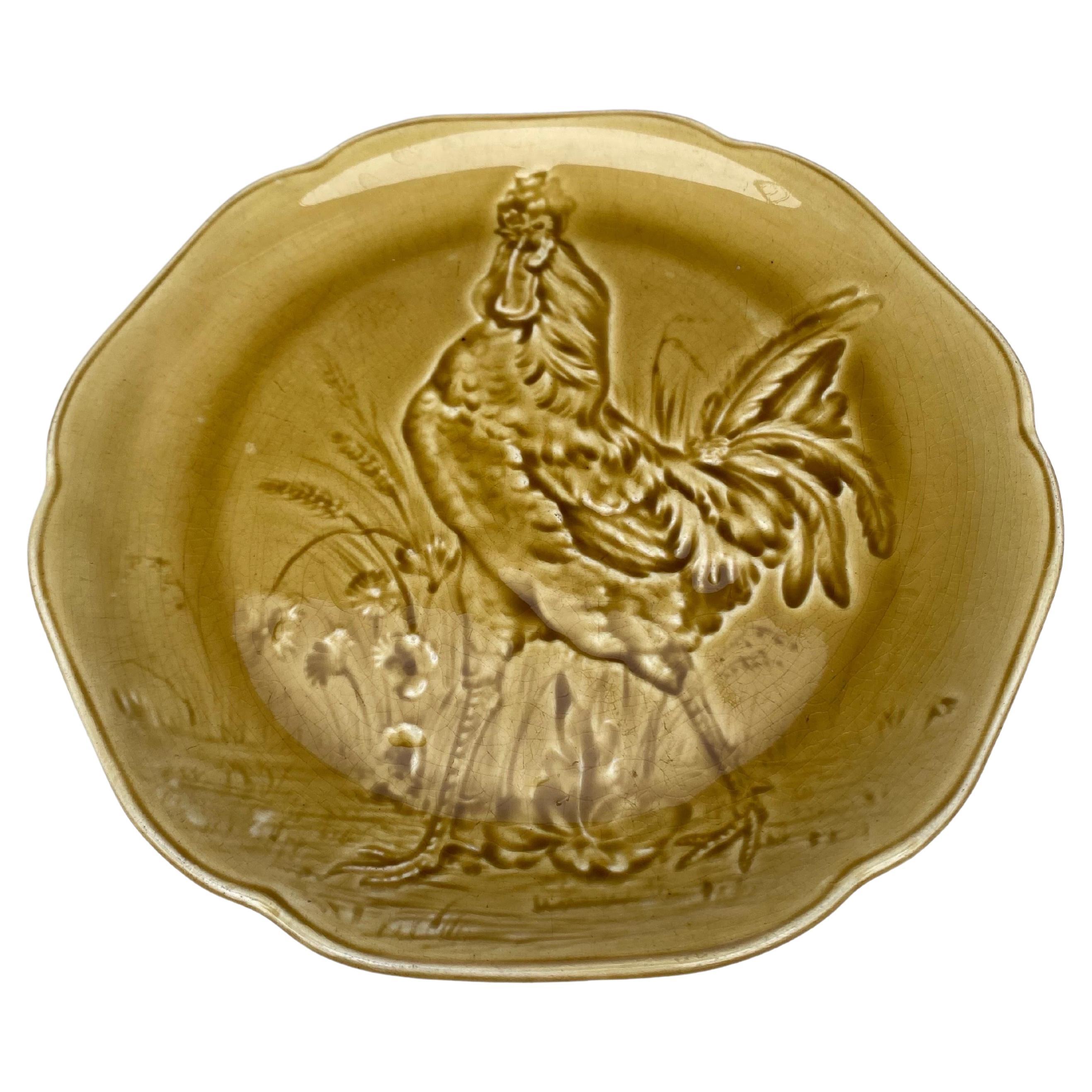 Lovely yellow Majolica plate with rooster signed Hippolyte Boulenger Choisy le Roi, circa 1890.
The manufacture of Choisy le Roi was one of the most important manufacture at the end of 19th century, they produced very high quality ceramics of all