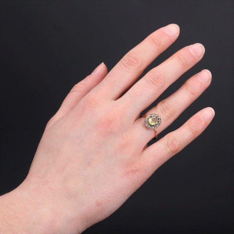 Ring in 18 karat rose gold.
Charming daisy ring, it is set in the center with thin claws of a yellow oval sapphire in an entourage of rose-cut diamonds.
Total weight of the sapphire : approximately 1.40 carat.
Height : 13 mm, width : 10.7 mm,