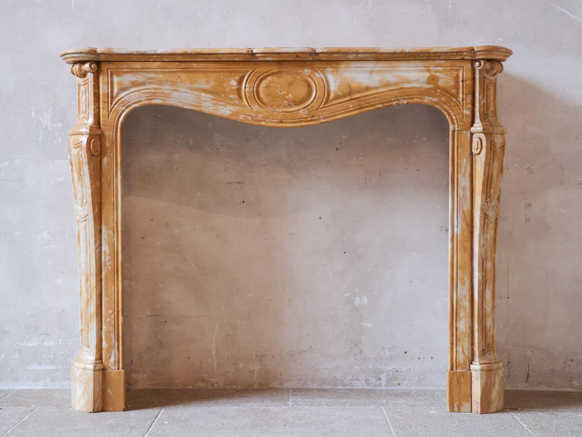 19th-Century yellow Sienna marble mantelpiece. Antique Pompadour 