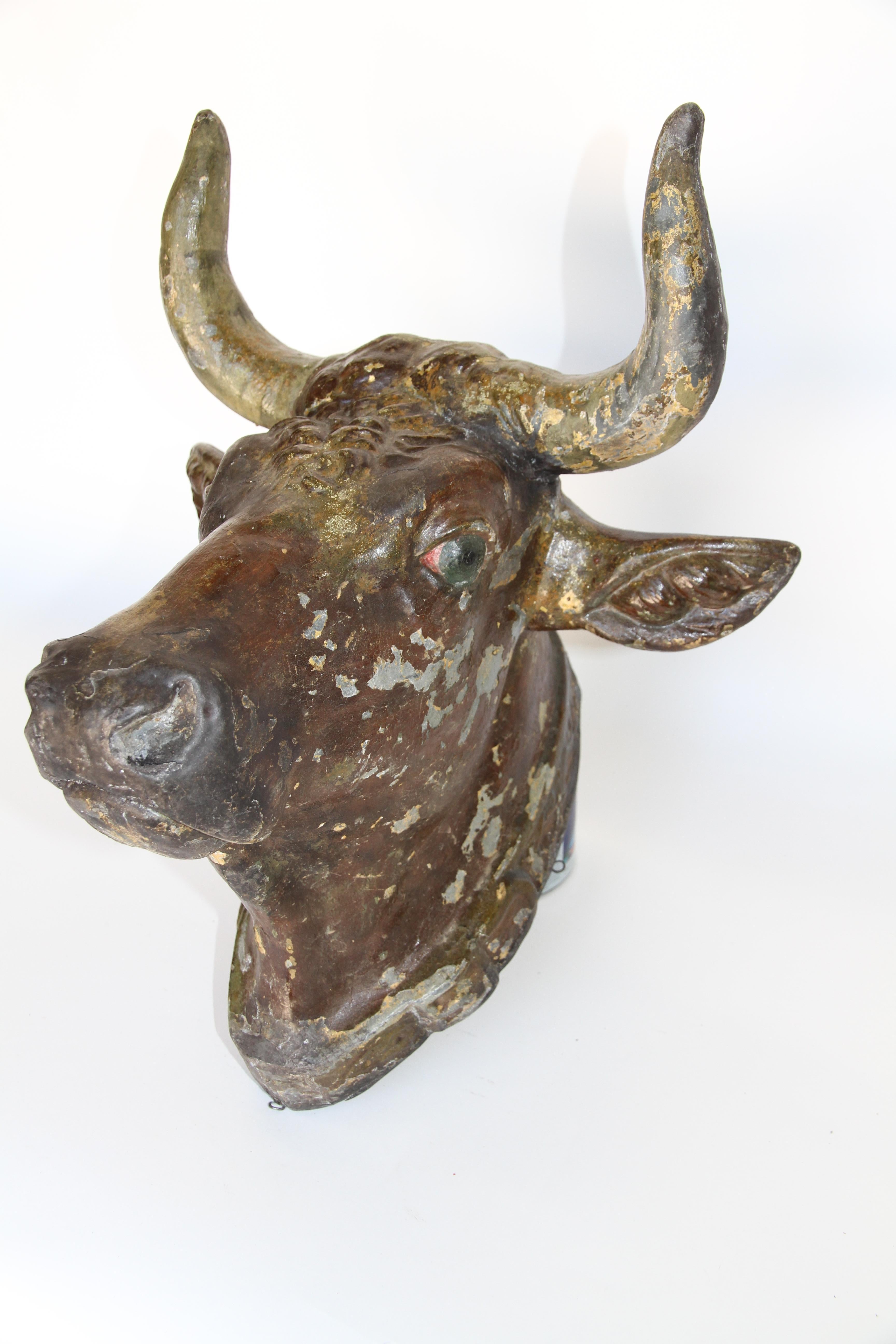 This 19th century zinc bull head was originally used as a trade sign for a French butcher shop. The painted patina adds character and the overall condition of the head is very good. Perfect for your indoor kitchen.