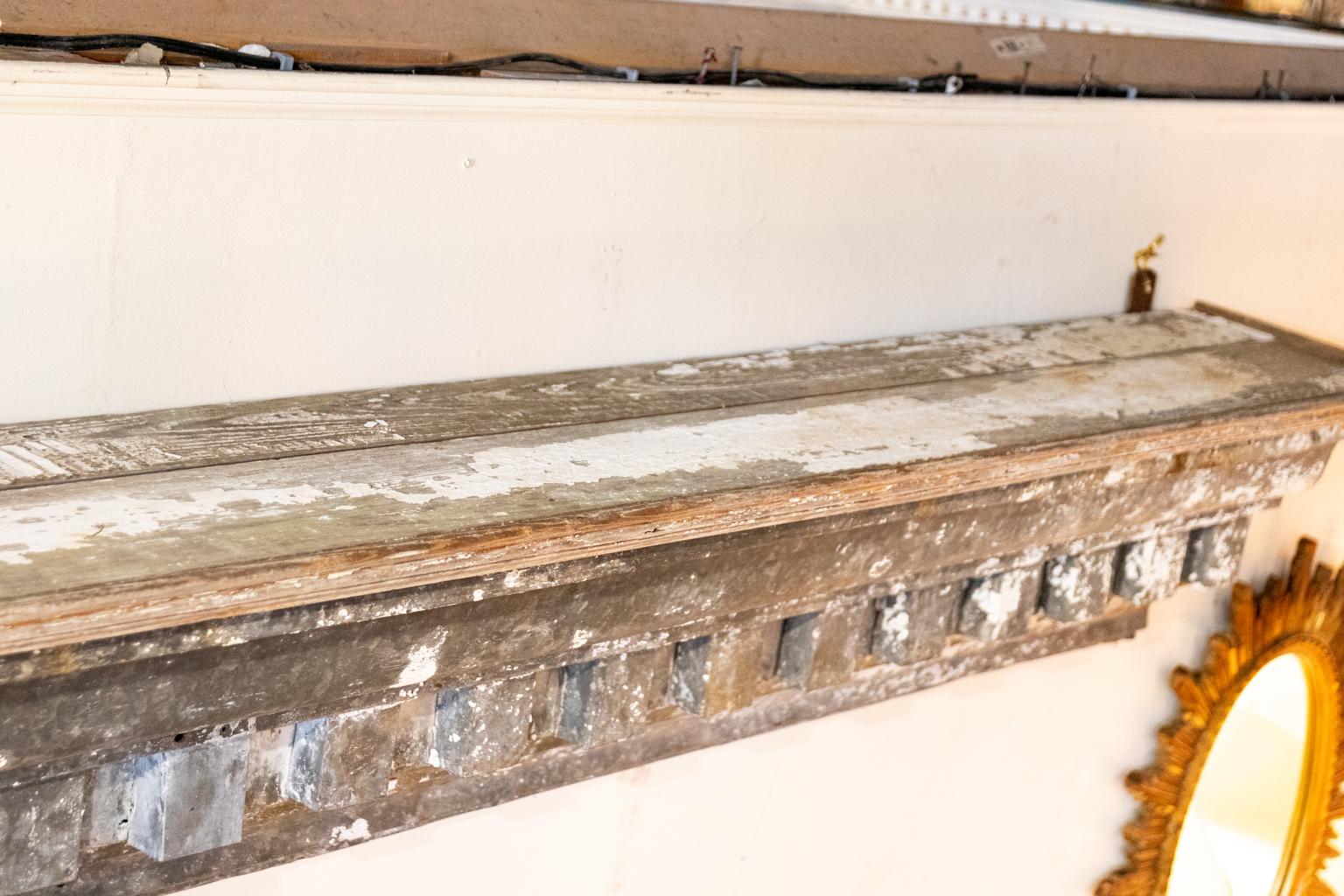 Circa 19th century Zinc cornice shelf with dentil trim and wood top and ends. Please note of wear consistent with age including remnants of old white paint and patina.