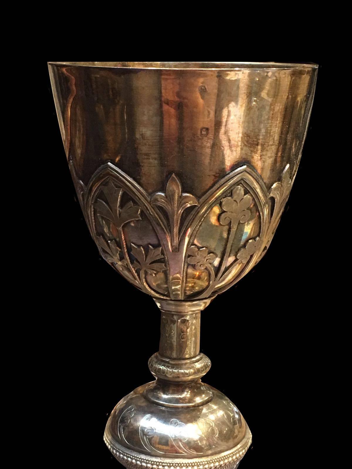 19th century, continental silver gilt chalice, decorated with arcading and letters.
