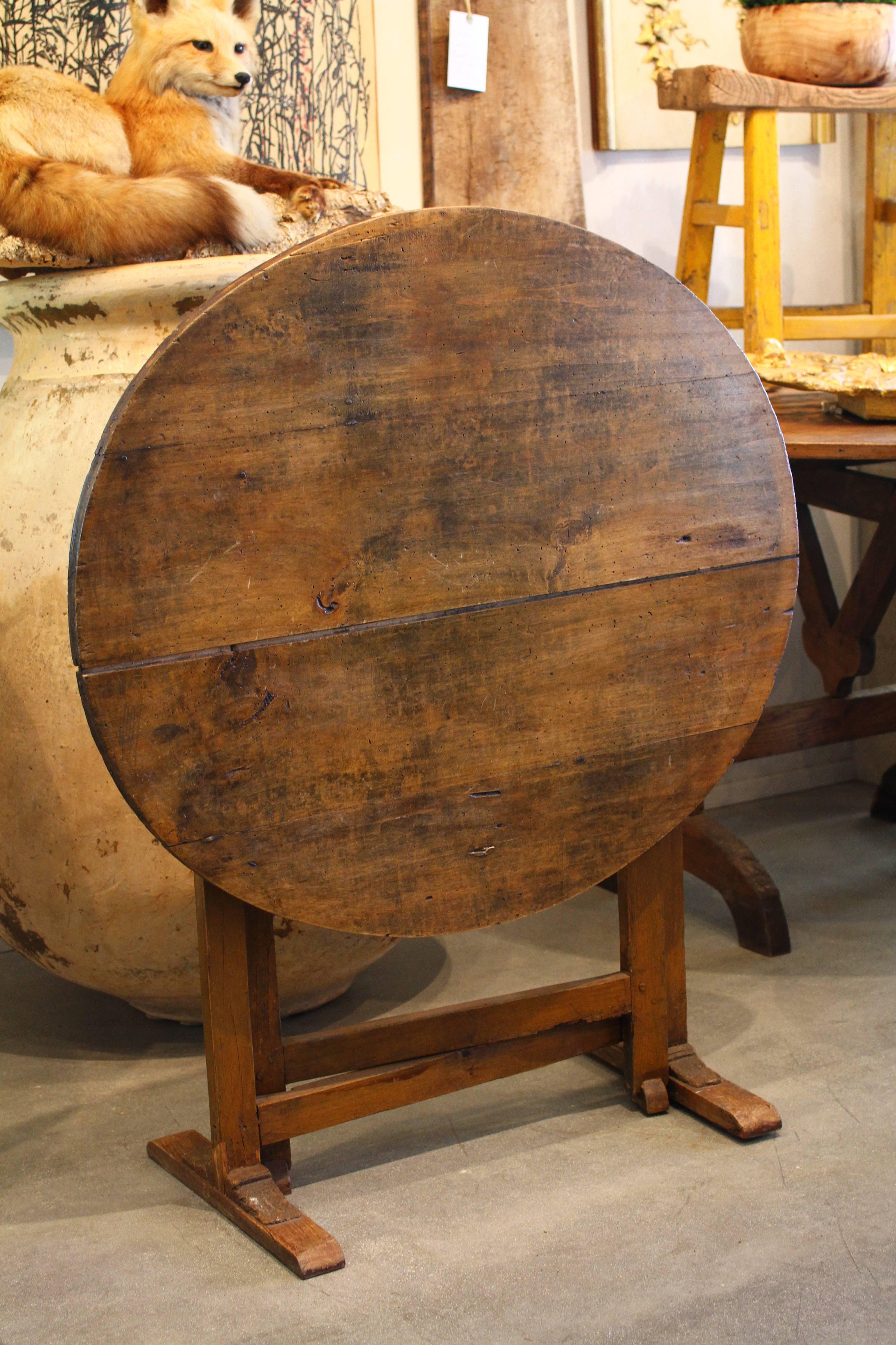 Vendage wine tasting tables were widely used in France as pop up apero opportunities in the vineyards and fields for meals and tastings. With its tilt top and gate legs, this small Vend age wine tasting table is a very versatile size and would be