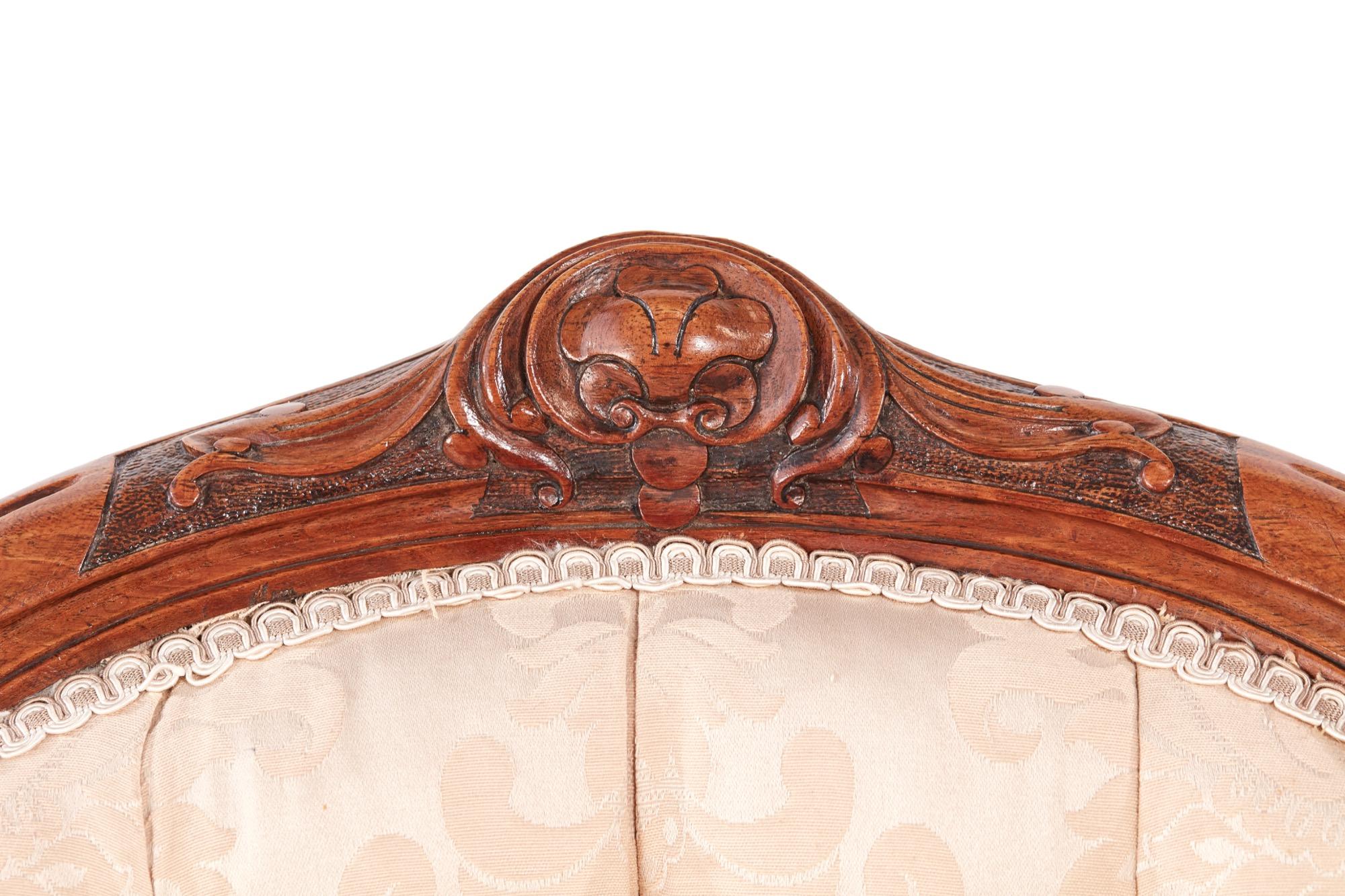 Quality 19th century Victorian carved walnut ladies chair with a walnut shaped framed back and pretty carved top rail. Newly reupholstered in a quality fabric and standing on carved shaped cabriole legs to the front and outswept back legs with