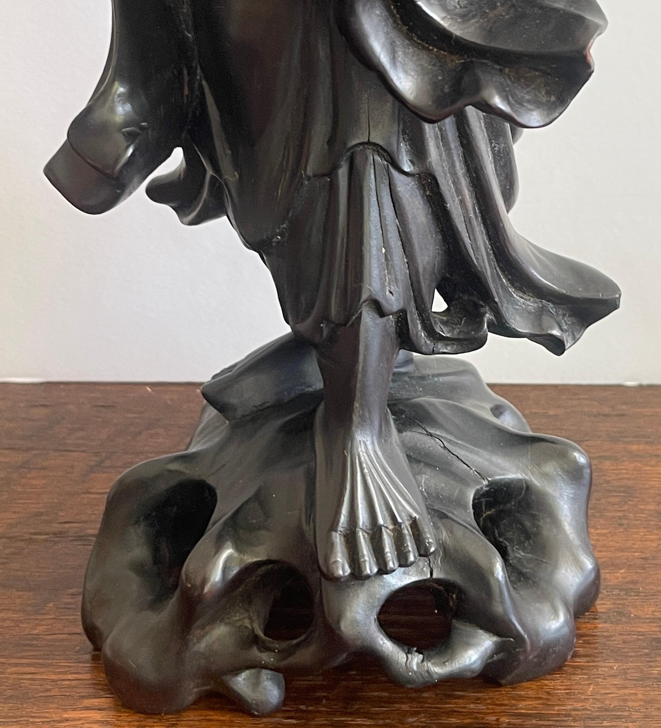 19th Century 19th Chinese Carved Hardwood Figure of an Immortal Holding a Bat For Sale