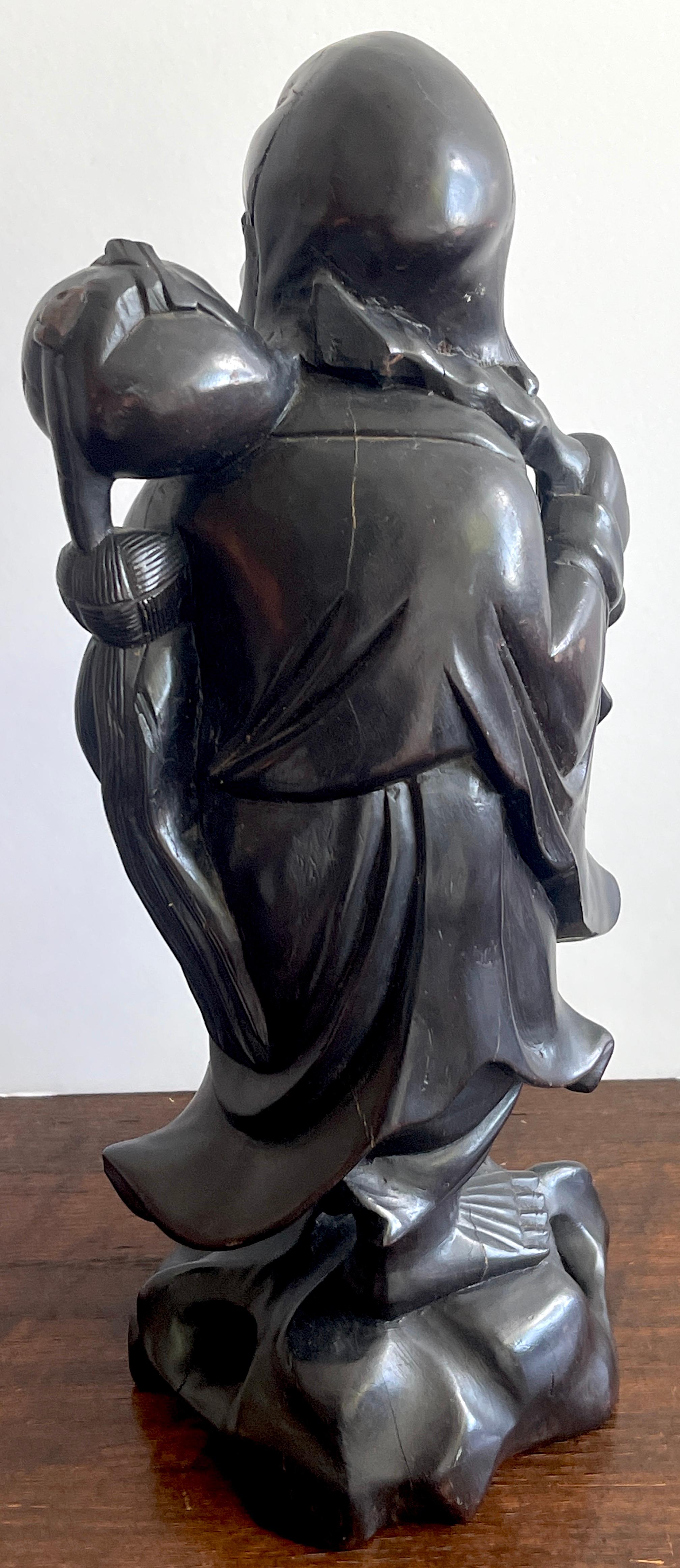 19th Chinese Carved Hardwood Figure of an Immortal Holding a Bat For Sale 1