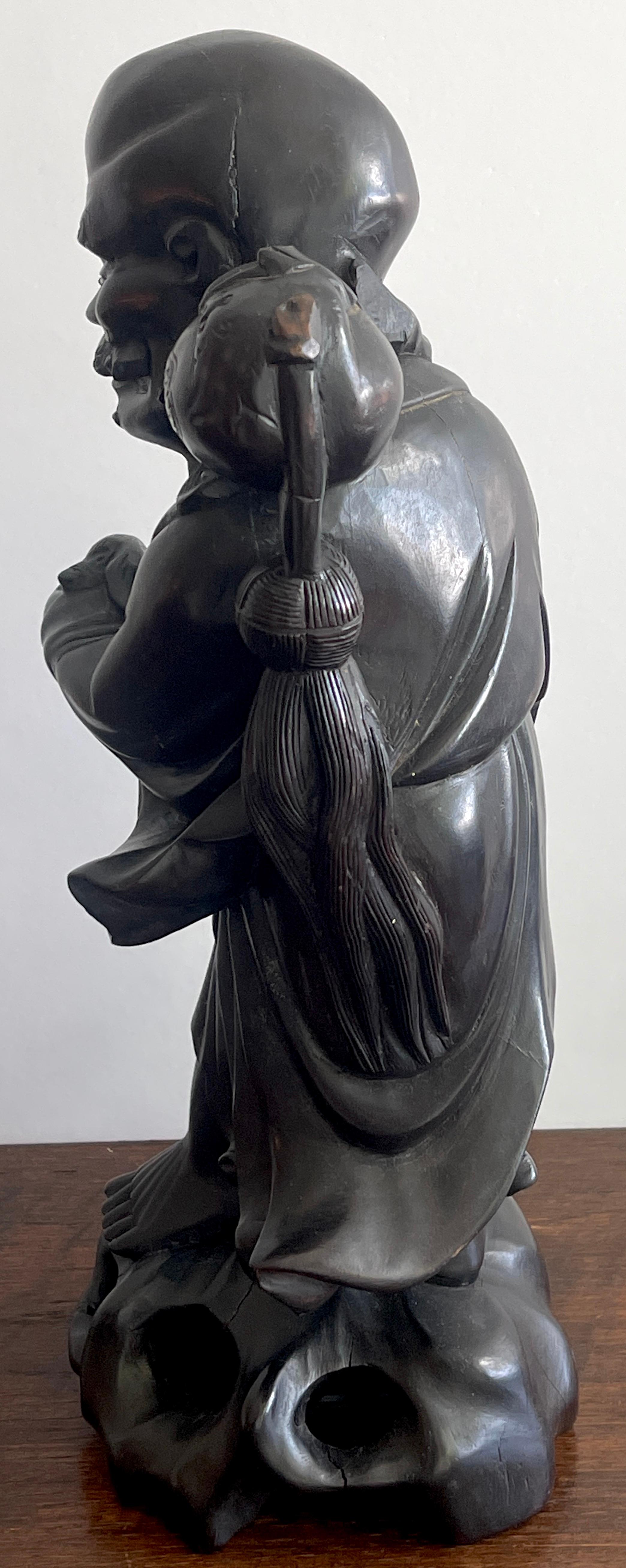 19th Chinese Carved Hardwood Figure of an Immortal Holding a Bat For Sale 2