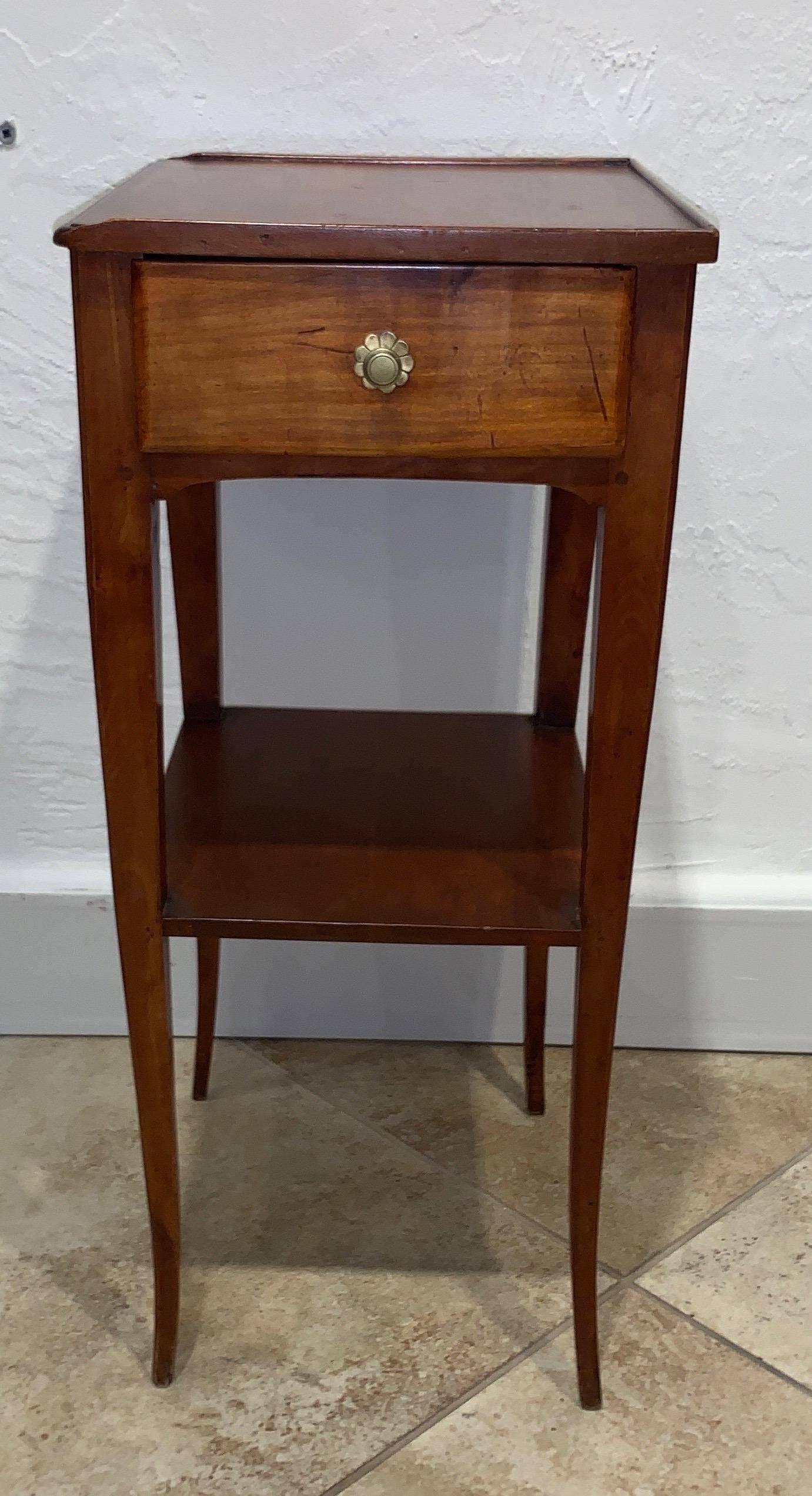 1830s French Provincial walnut side table. Shelf underneath with a drawer on the side.