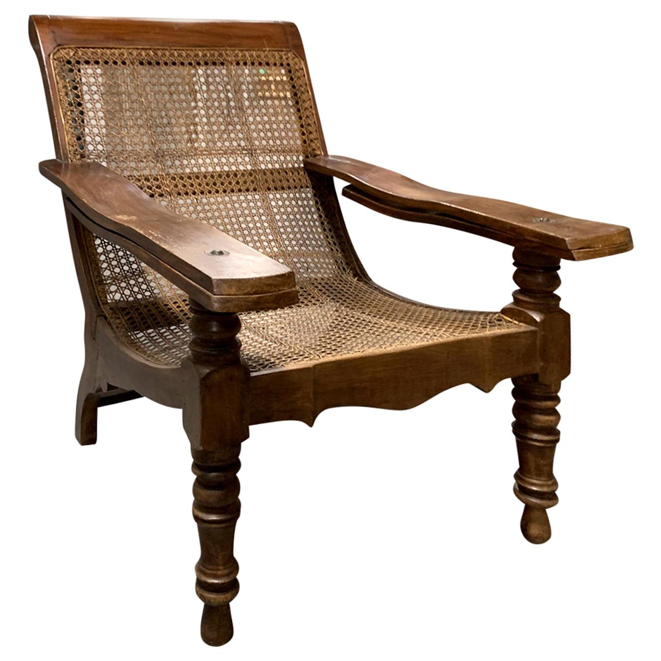 19th-Early 20th Century Anglo-Caribbean Caned Planters Chair with Leg Stretchers