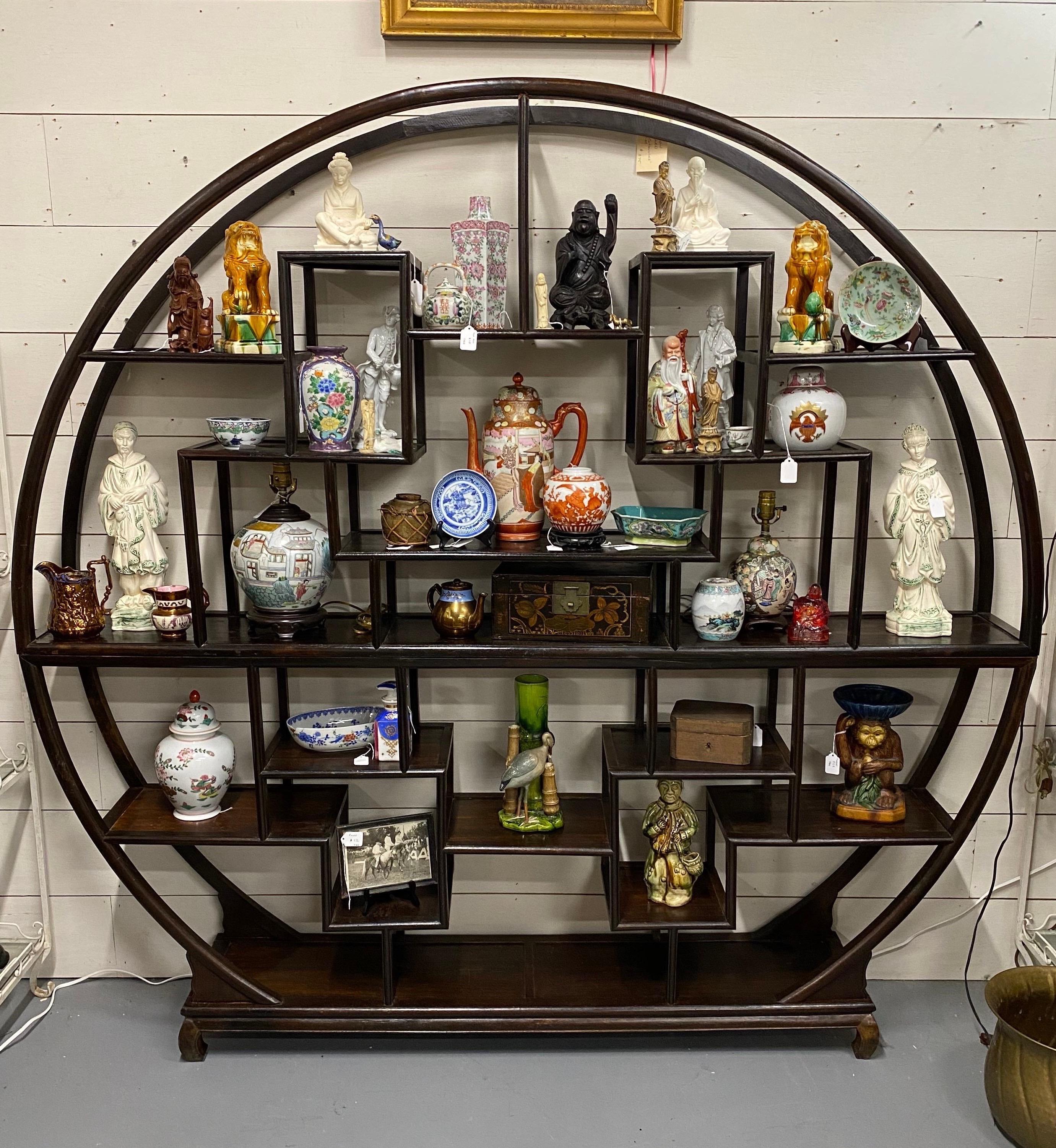 Great quality and color on this late 19th-early 20th century Chinese 2 part étagère. Piece is hand carved and in its original lacquer finish. Separates into two parts in the center- see photos 

Would make an incredible room divider or 