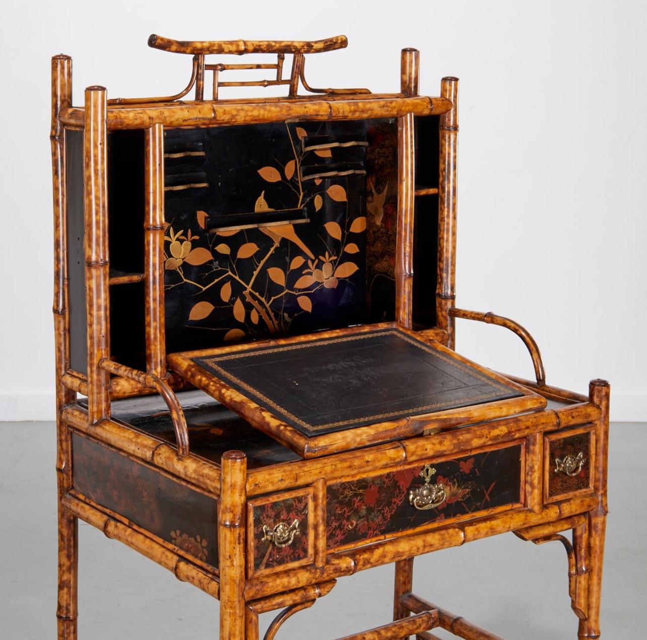Just in,  this 19Th. English Colonial Tortoiseshell Bamboo  & Lacquer Drop-Front Desk .
Lovely Tortoiseshell color to the Bamboo through out with large accents of Japanned Lacquer plaques to the from and sides with birds and florals.
Three drawers