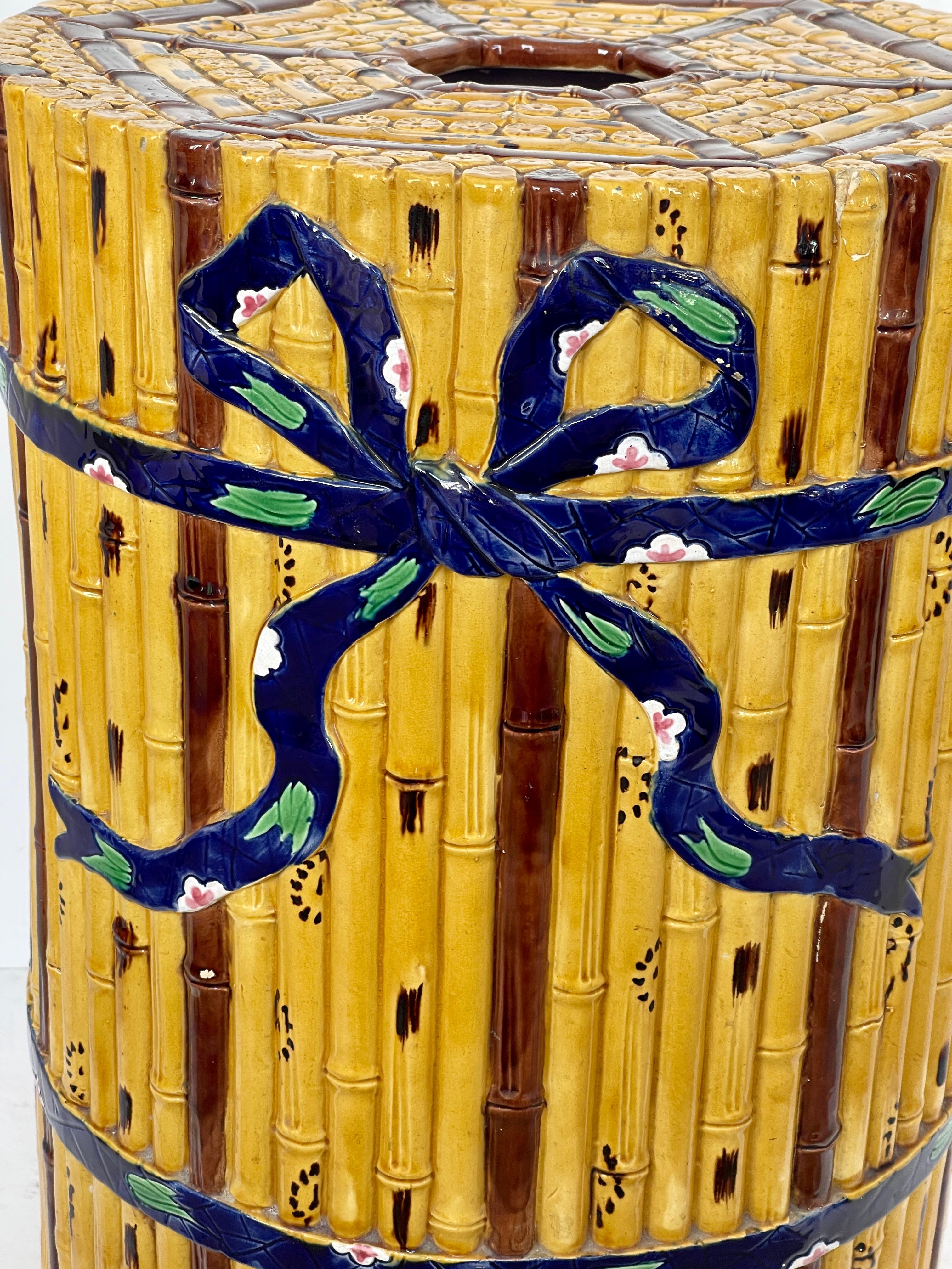 This is an amazing example of the English Minton Factory.
This garden seat is quite unique, circa 1865.
Minton Majolica garden seat features a bundle of bamboo tied with decorated Cobalt blue ribbon.
This garden seat has all the colors of real