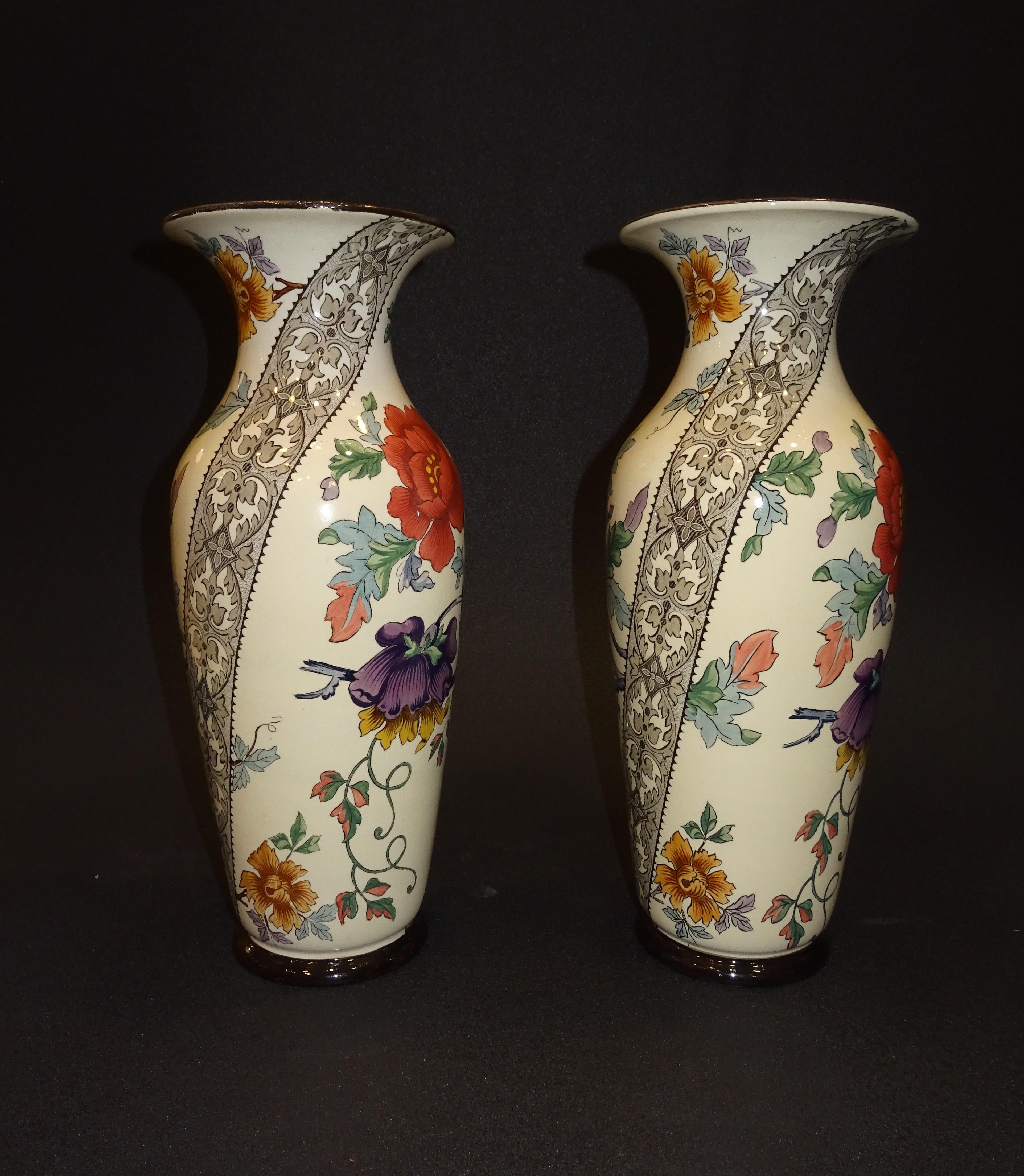 Outstanding pair of French ceramic vases with red and purple poppies and lace border as decoration, the manufacture is Gien, France (1875-1984), it was specialized in the elaboration of table and ornamental pieces as well as tiles, it has an