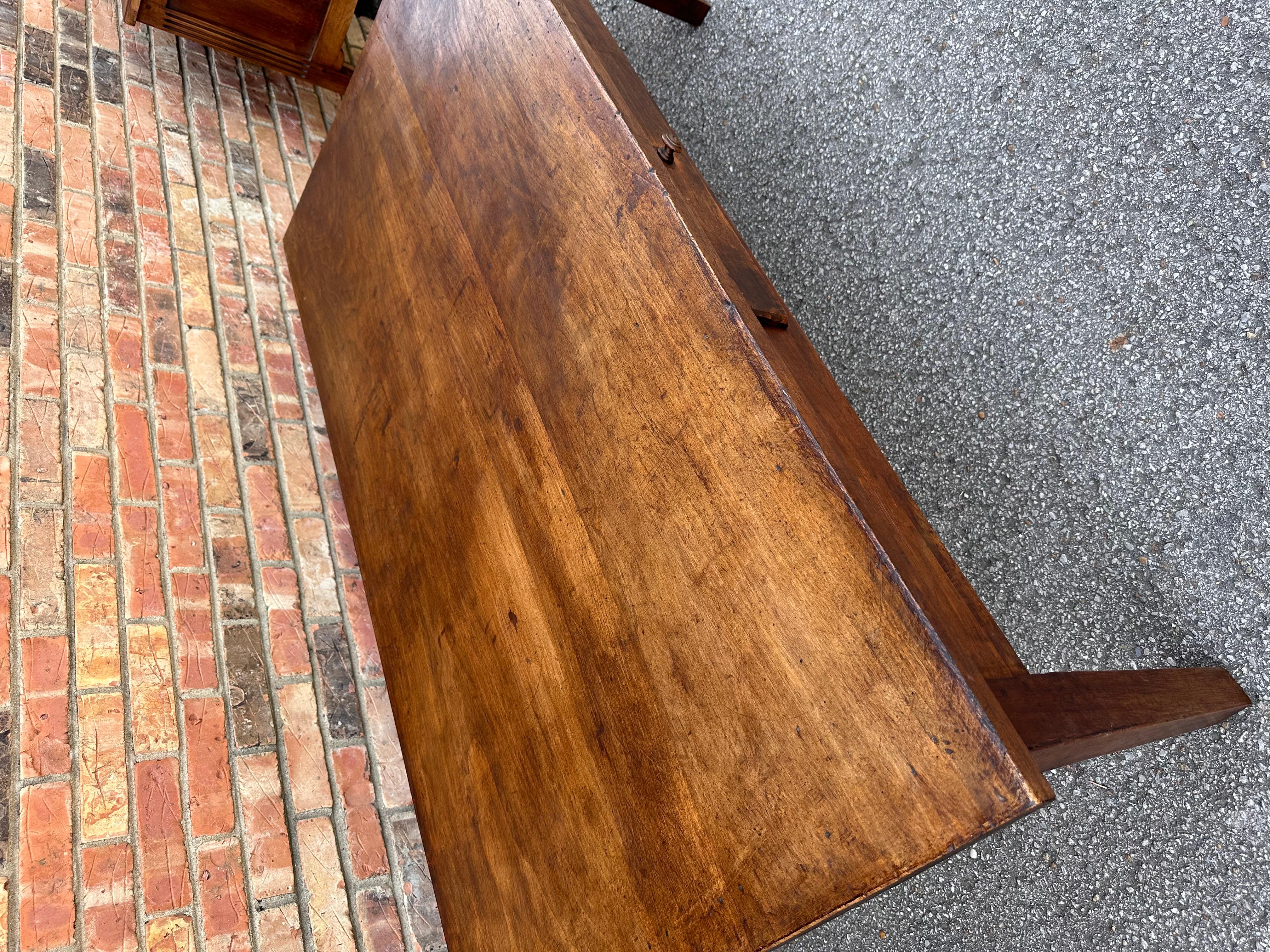 This is a beautiful mid 19th century French coffee table. The walnut wood gives it a nice warm tone and with such amazing patina. A single drawer to hold all the remotes we have to deal with these days. These tables are virtually indestructible
