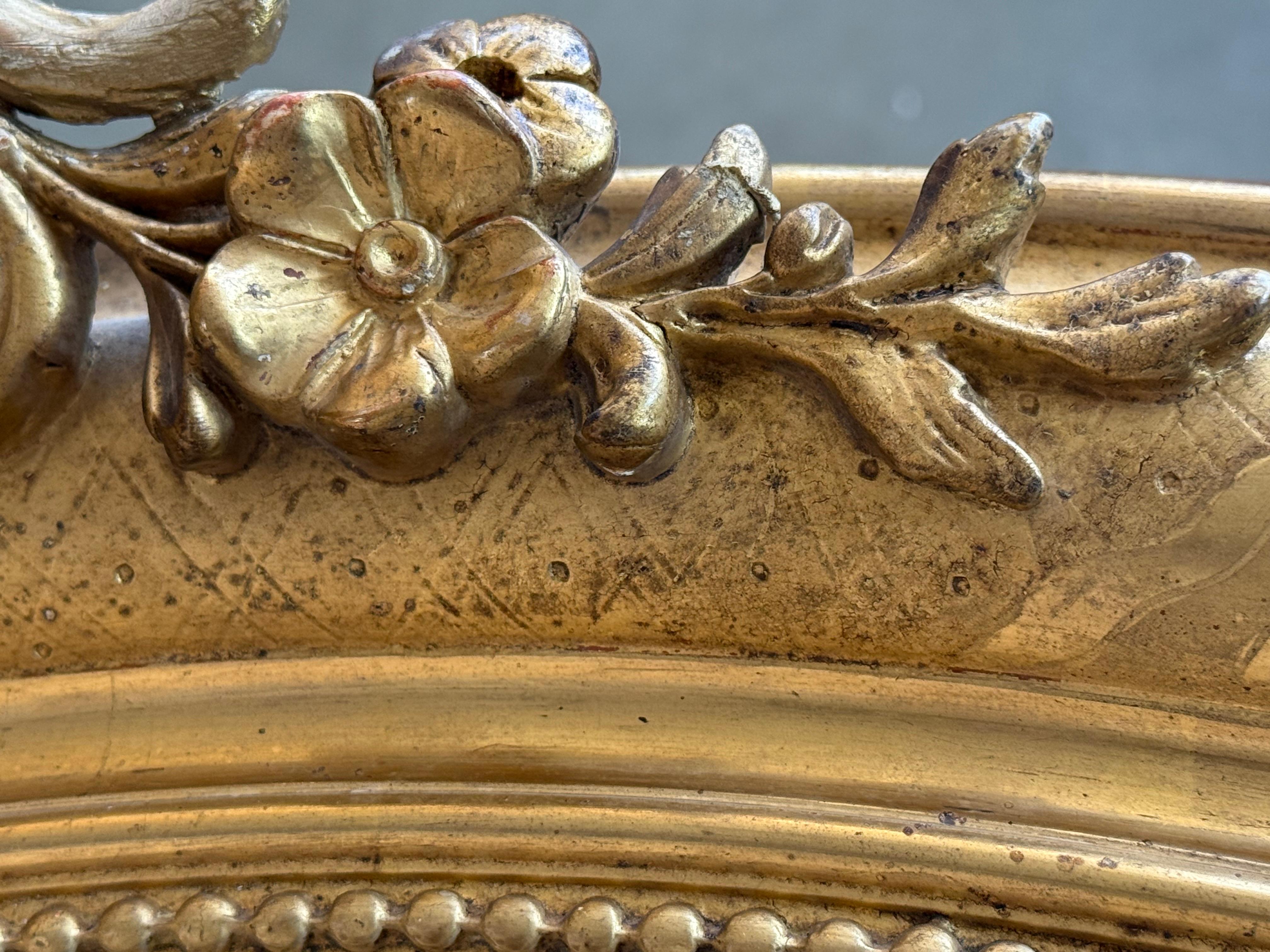 XIX secolo Specchio ovale in legno dorato del 19° periodo Impero francese in vendita