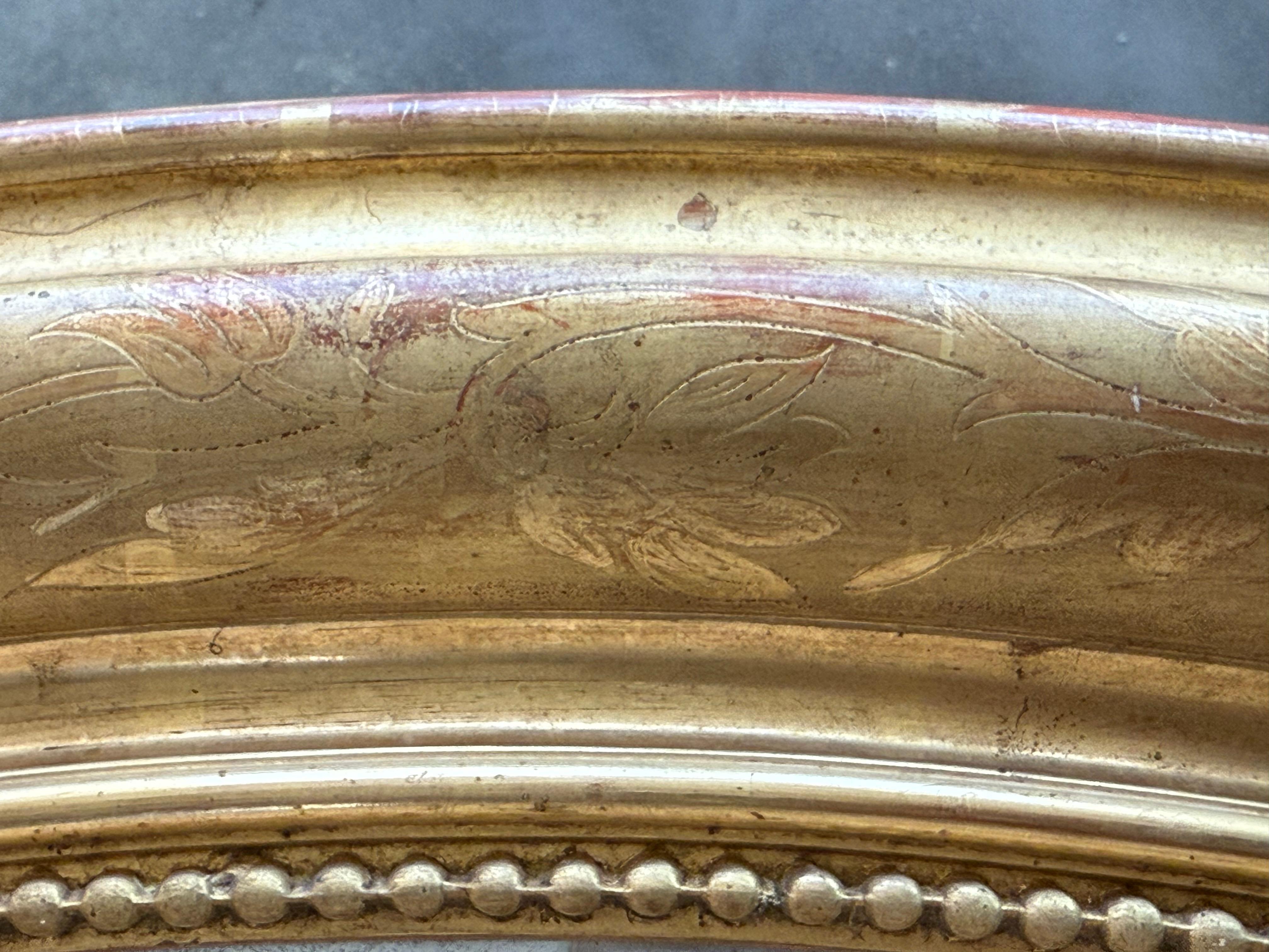 Legno dorato Specchio ovale in legno dorato del 19° periodo Impero francese in vendita