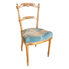 XIX Silla francesa Luis XVI dorada con tapicería azul