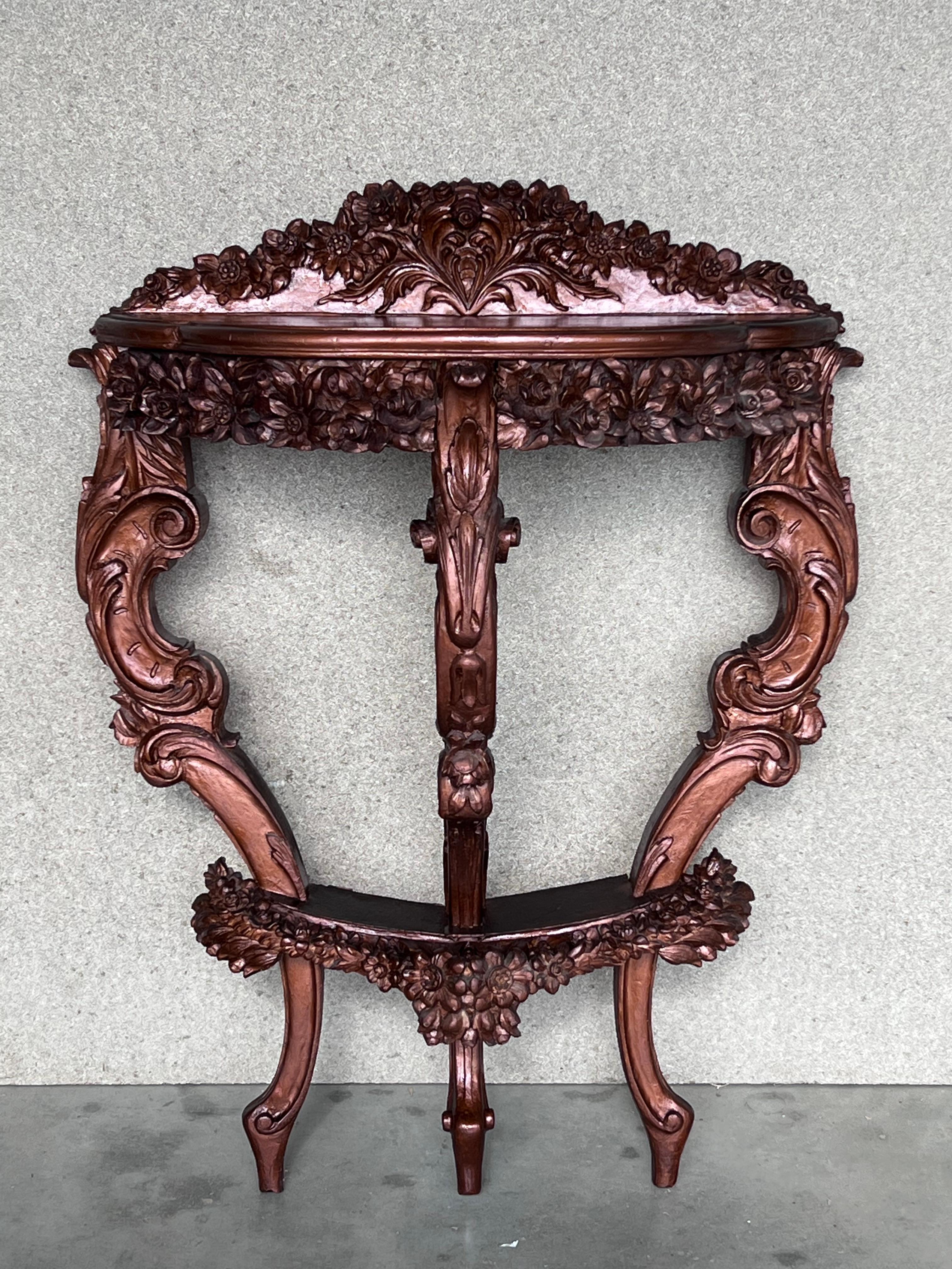 19th century French Regence style beautifully carved with leaves walnut console. Hand-carved frieze supported by three cabriole legs connected by X-form stretchers centered by large urn.
 