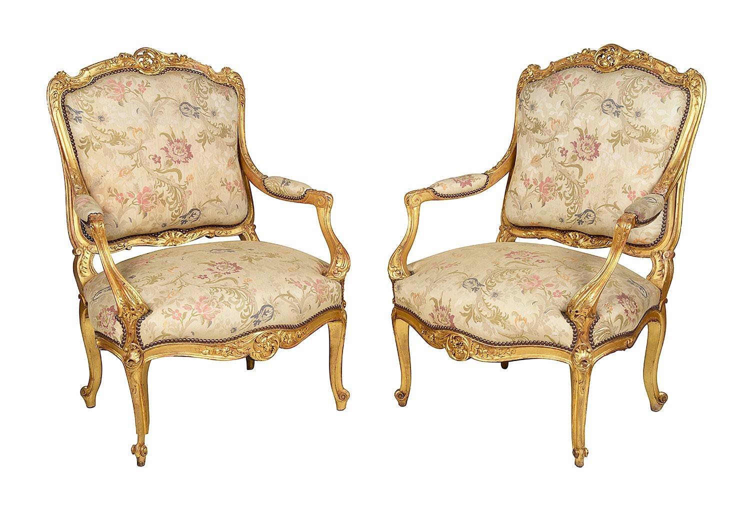 A good quality late 19th century French carved gilt wood Salon suite, conceding of a pair of arm chairs and matching sofa. The gilded show-wood having classical scrolling floral decoration and raised on elegant cabriole legs. The classical tapestry