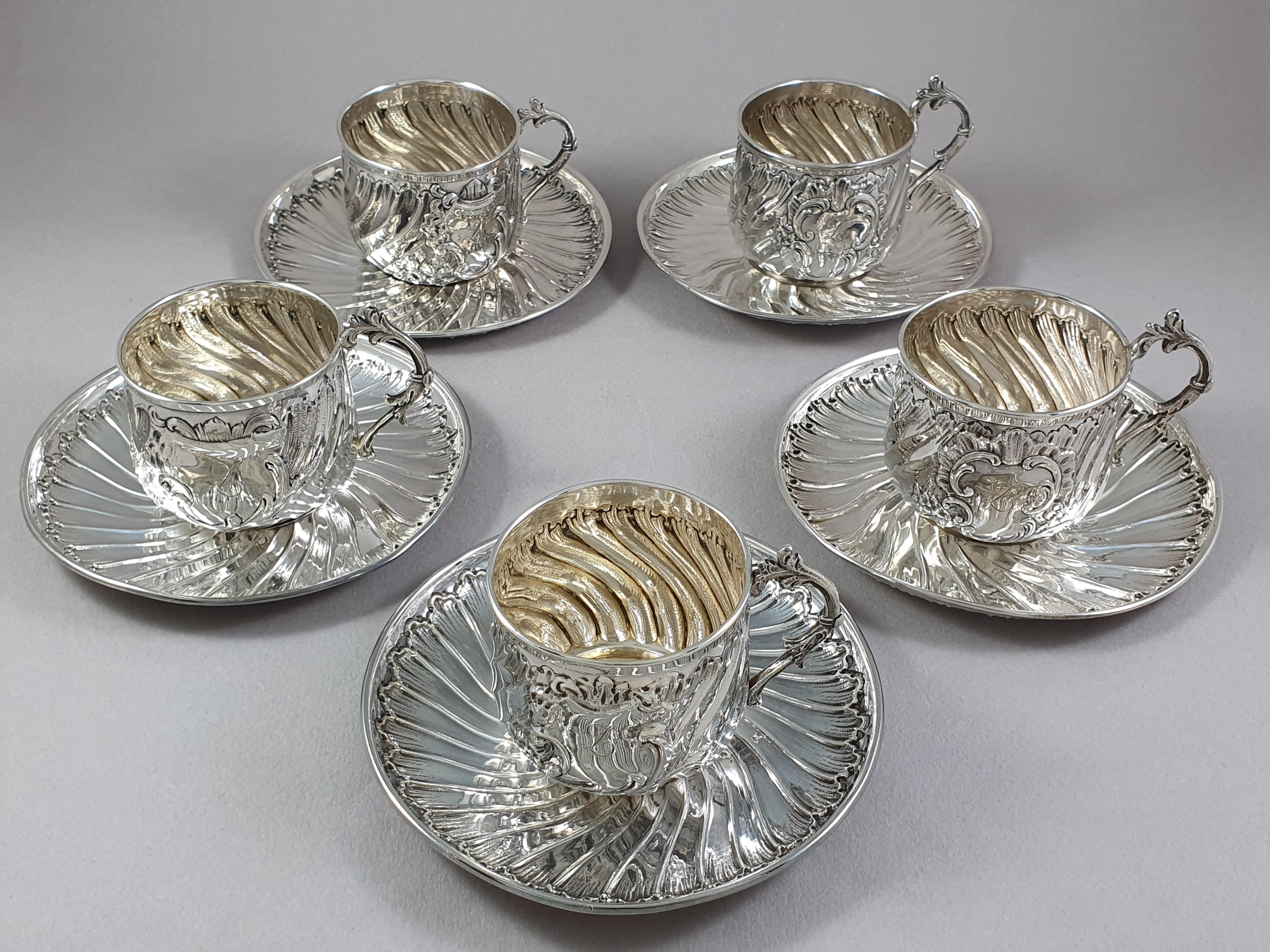 19th French set of 5 Sterling Silver Tea Cups and Saucers

With twisted decoration, the medallion surrounded by rockery motifs and flowers 

Hallmarked Minerva 1st title for 950/1000 purity silver
Silversmith: Bouclier & Paris 

Cup height: