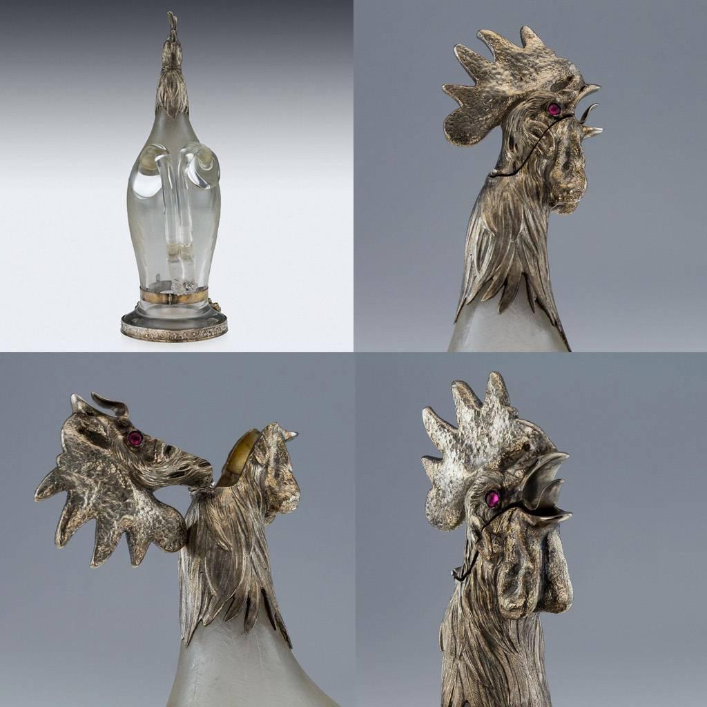 Antique 19th century German solid silver mounted hand etched glass novelty decanter, modelled as a realistically modeled crowing rooster, with the silver head cast with a hinged lid, the shaped glass body intricately etched to simulate feathers,