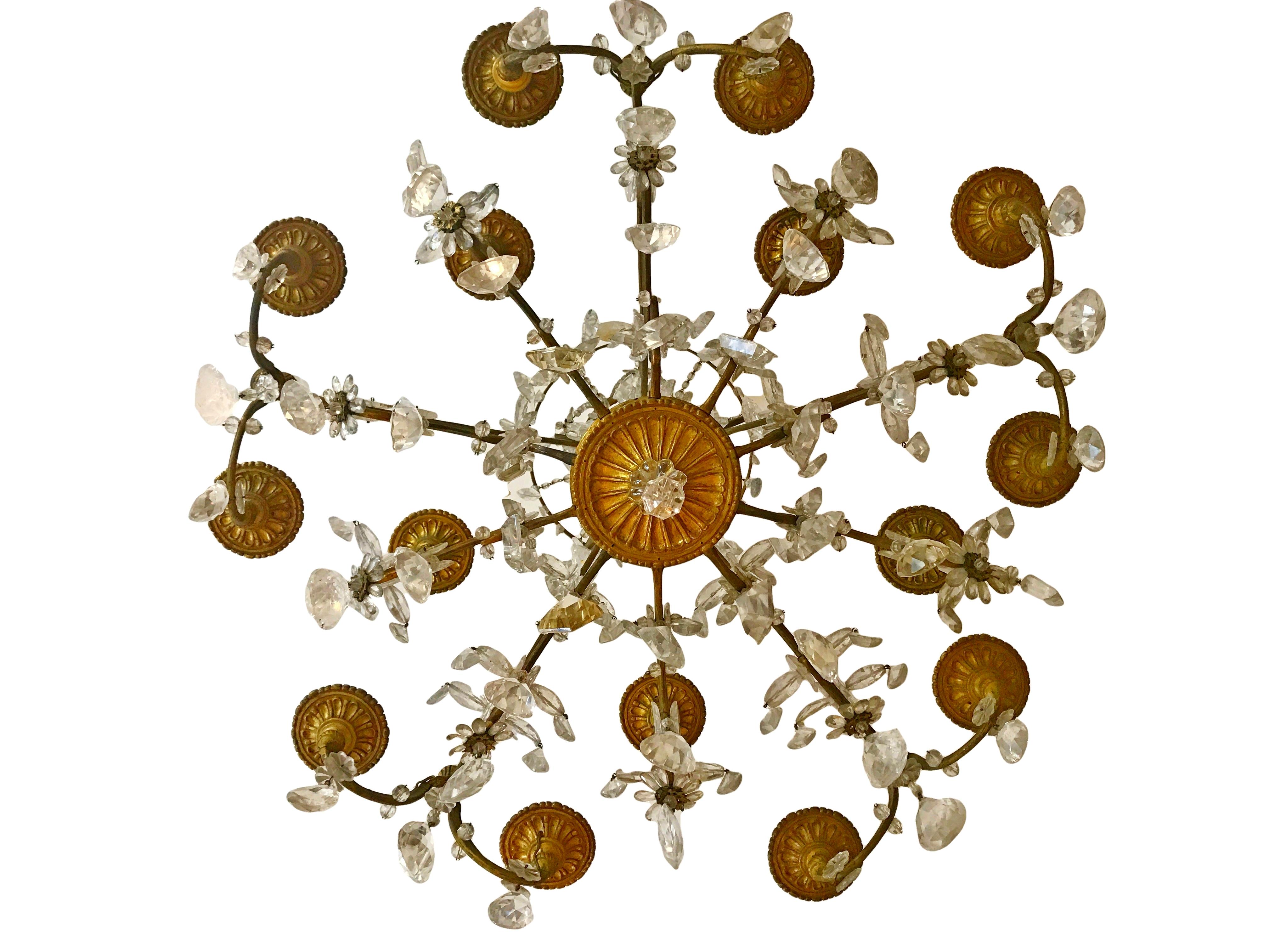 This large scale, stylish and chic rock crystal chandelier was created in France from early 19th century in the Louis XV style. It’s with 16 candle lights and in gild bronze structure. This piece was acquired from a famous Accorsi collection (Italy)