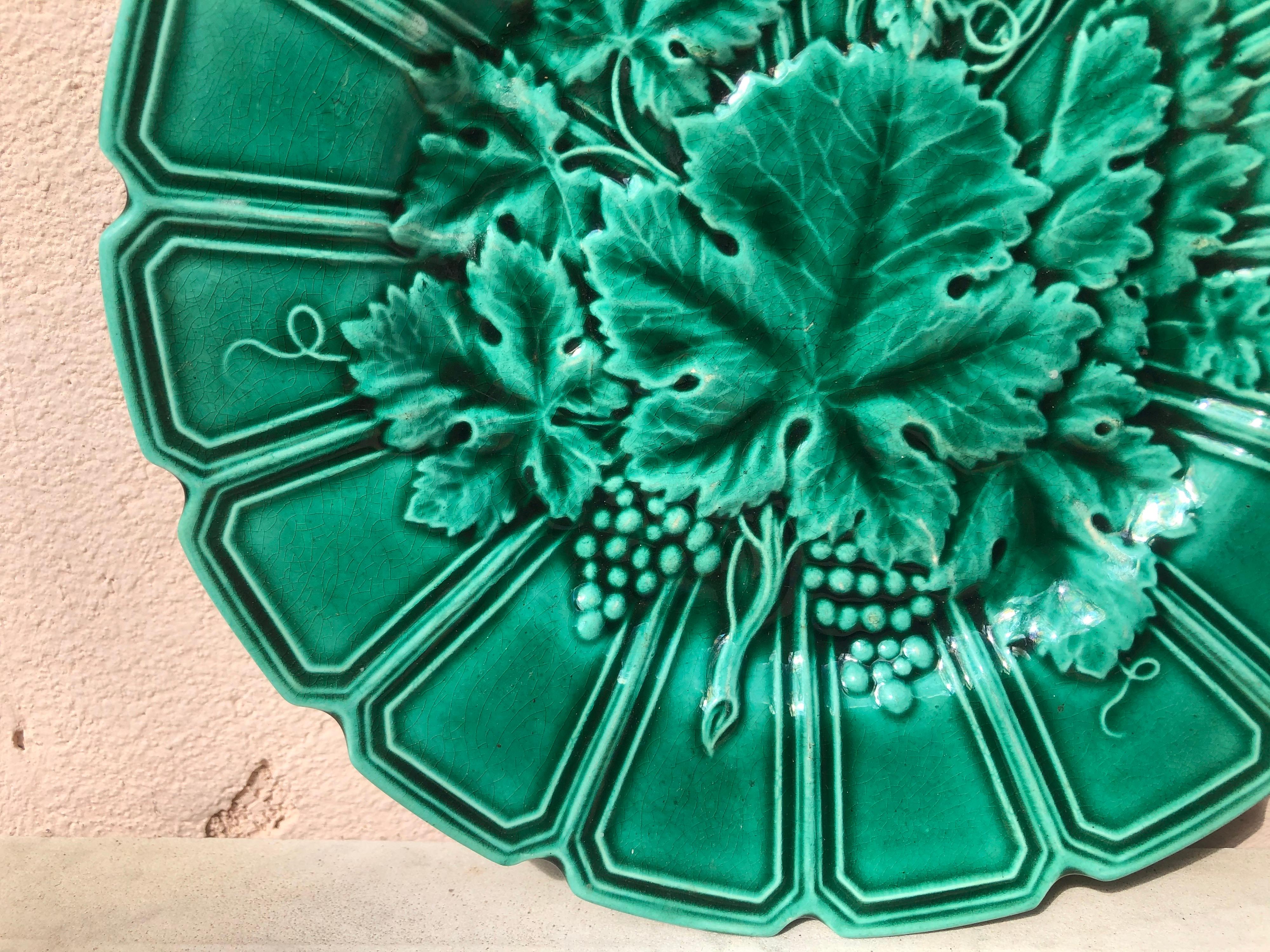 19th century French green Majolica plate with vine leaves signed Sarreguemines.