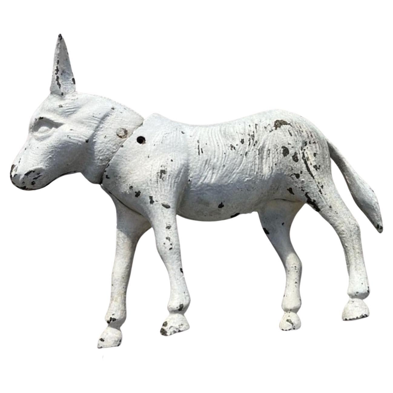 19Thc Original white painted nodder donkey in fine condition and amazing original surface. This donkey could be a door stop or just cool heavy folk art!.