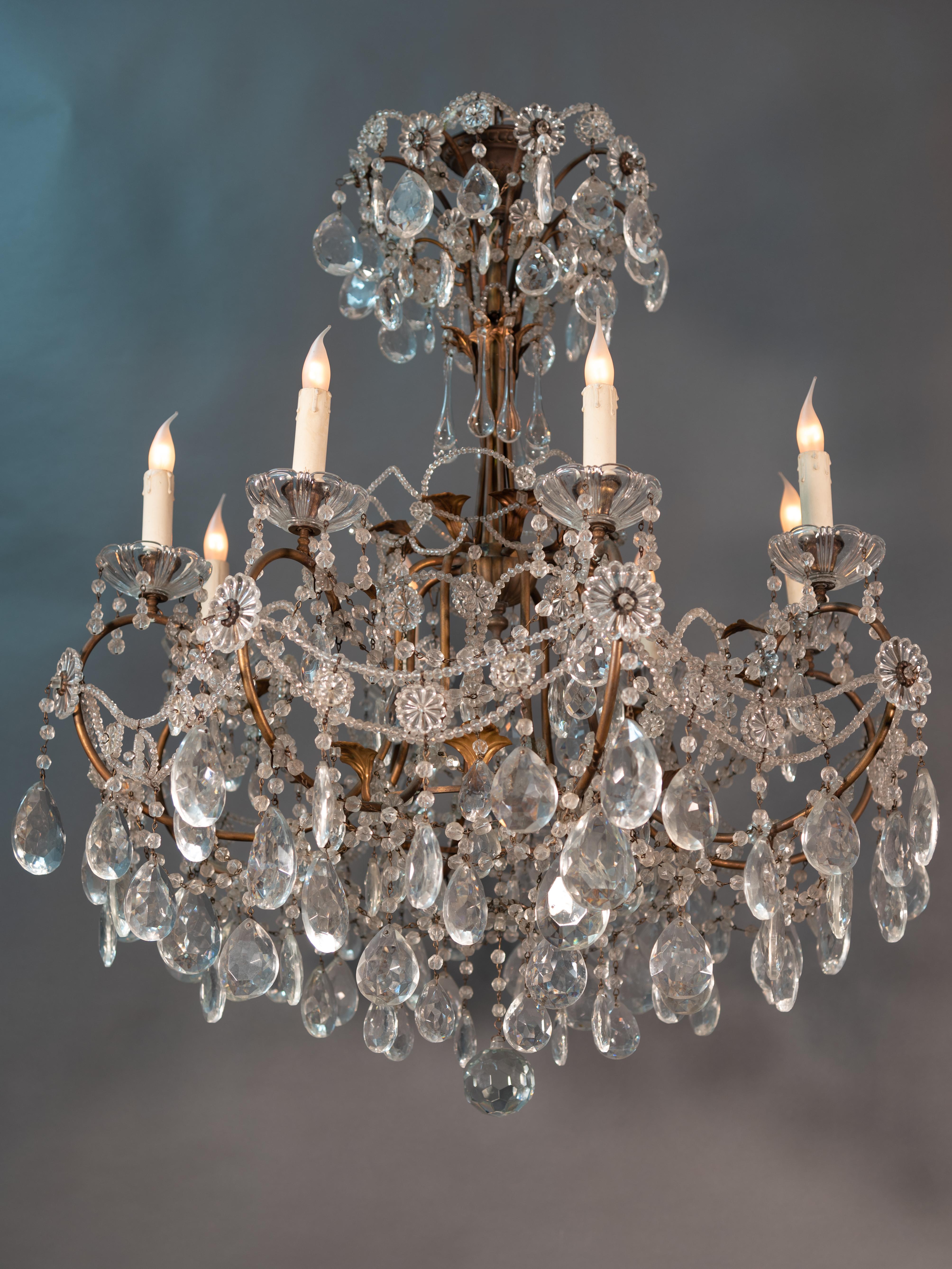 This chandelier feature a cascade of tear-drops, roses, festoons, chains of pearls, sequins, and crystals, making them decor pieces of peerless elegance, splendor, and glamor.
Completely original in all his pieces, is in an exceptional state of
