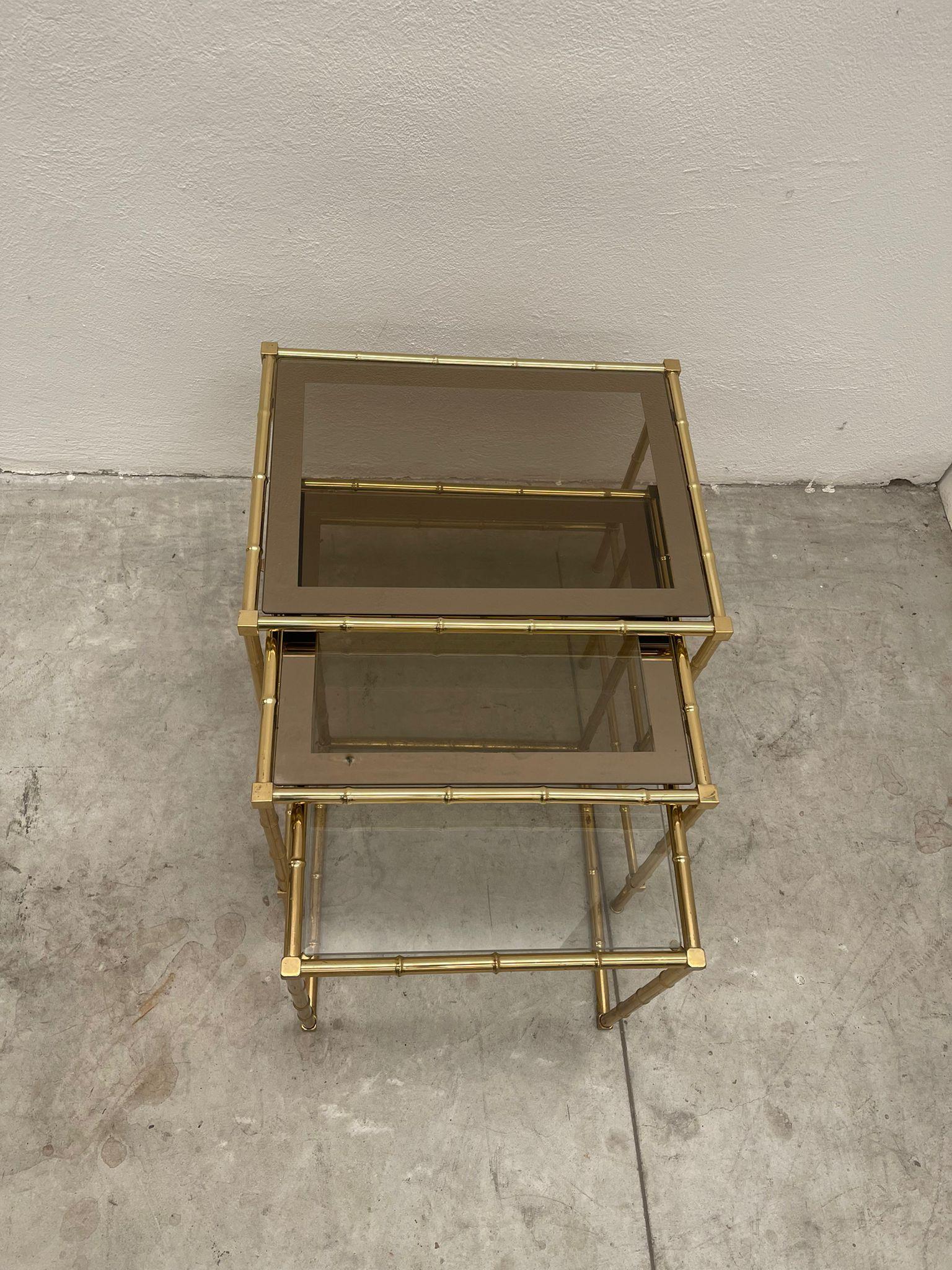Trio of tables made in brass in Italy. In bambu design Due to the signs of aging which makes the piece unique, it was decided not to make any changes.

Made and Designed by Mice di Rugiano.