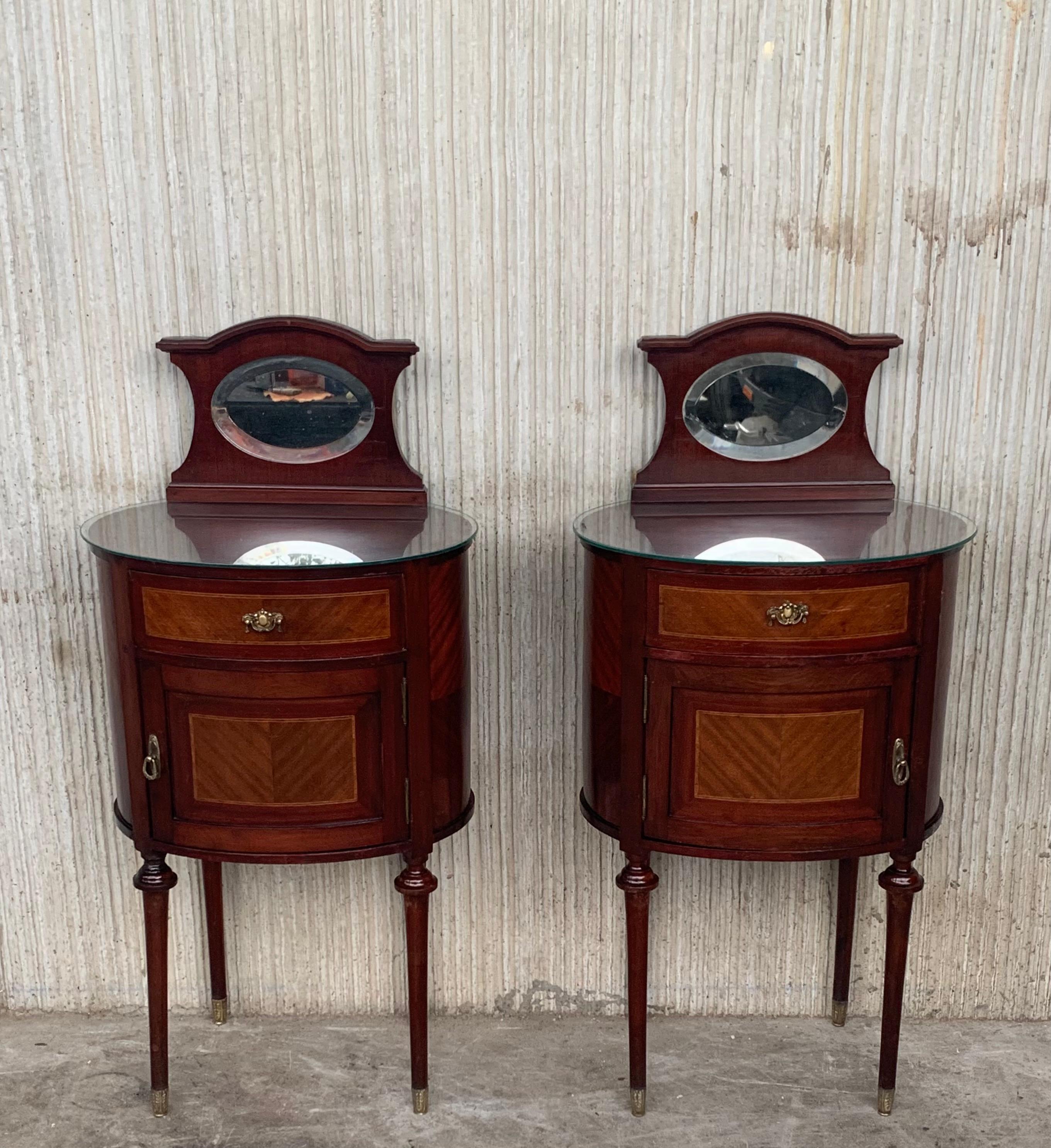 Louis XVI style pair of Marquetry nightstands with bronze crest one drawer and one compartment.
Originals handles and garniture.
Completely restored.

Total height : 42.12 in
Height to the tabletop: 32.28 in.